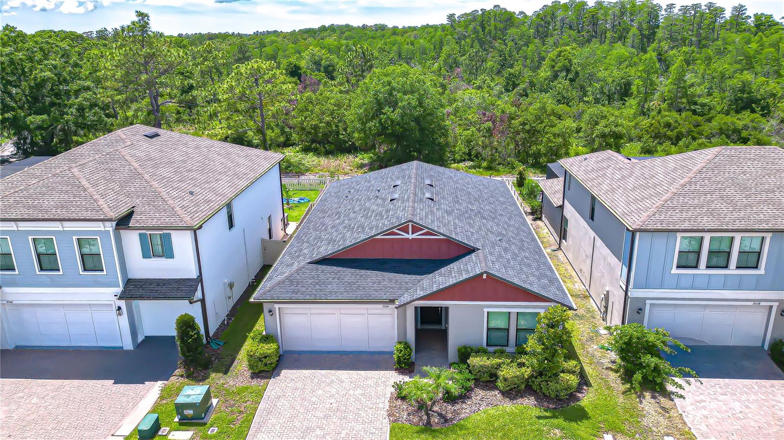 This meticulously maintained ultra-modern floor plan in Connerton 2 offers a sleek four-bedroom, three-bath home that is move-in ready, with no waiting for construction delays. This single-story home boasts tranquil conservation views and features an open floor plan in the kitchen / living area. The three-way split bedroom plan includes a Jack & Jill bathroom connecting two bedrooms, while the fourth bedroom has its own adjoining bath. The kitchen complete with chic coffee bar, wine fridge, stylish cook top/ range hood and walk in butler pantry is sure to delight.  The primary bedroom features an enormous walk in shower and equally large walk in closet. Soft grey plank tile flooring throughout with soft grey carpet in the bedrooms with ceiling fans & full motion extended TV mounts for your convenience.  This award-winning master-planned community offers fantastic amenities including two clubhouses with state-of-the-art fitness centers, a cafe, eatery, and a vibrant calendar of events. Outdoor amenities include an amphitheater, a resort-style pool with a splash park, and an eight-lane Olympic-style lap pool. If you seek modern comfort, functional design, and a strong sense of community, look no further. Visit this lovely home today.