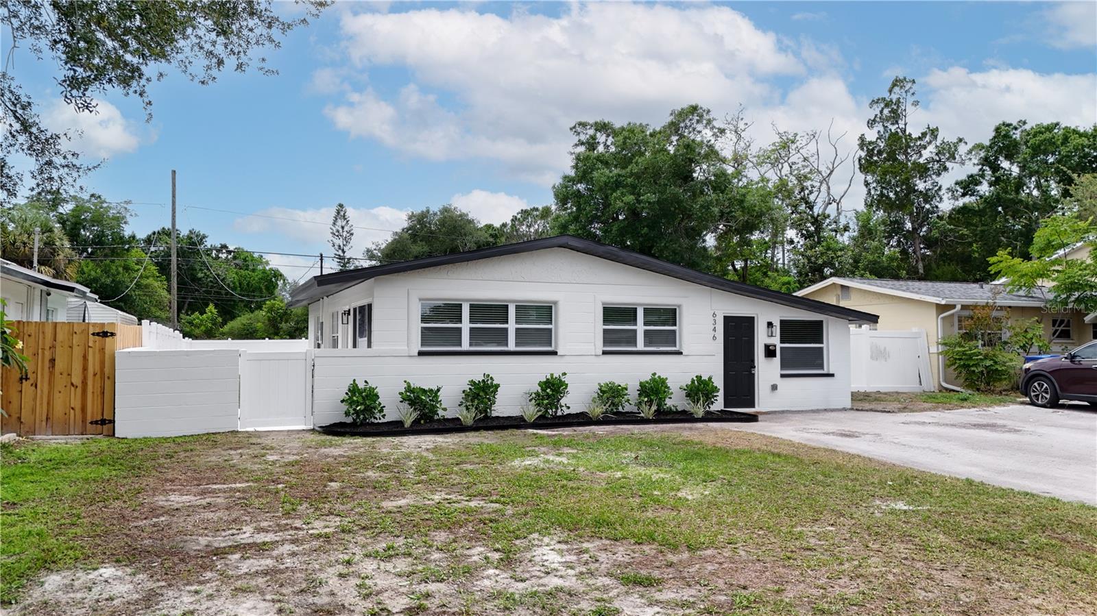Pool days, backyard barbecues, and effortless Florida living start here in this beautifully updated 3-bedroom, 1-bath St. Petersburg home situated on an oversized quarter-acre lot with a sparkling in-ground pool! From the brand-new roof to the fresh interior and exterior paint, this home has been thoughtfully renovated and is truly move-in ready. Step inside to an open-concept living and dining area featuring luxury vinyl plank flooring throughout and abundant natural light. The stunning kitchen is designed for both everyday living and entertaining, showcasing quartz countertops, custom cabinetry, stainless steel appliances, a gorgeous tile backsplash, and a peninsula with bar seating. The modern bathroom has been tastefully updated, and the indoor laundry room adds everyday convenience. Sliding doors lead to a screened lanai overlooking the private backyard oasis, complete with a refreshing pool, fully fenced yard, and plenty of room for pets, play, gardening, or future additions. Ideally located in the desirable Jungle Terrace area, you'll be just minutes from Walter Fuller Park, Boca Ciega Bay, Jungle Prada de Narváez Park, Tyrone Square shopping and dining, downtown St. Petersburg, and the award-winning Gulf beaches. Enjoy the best of the Florida lifestyle with recreation, entertainment, and waterfront attractions all within easy reach. Don't miss your opportunity to own this exceptional home, schedule your private showing today!