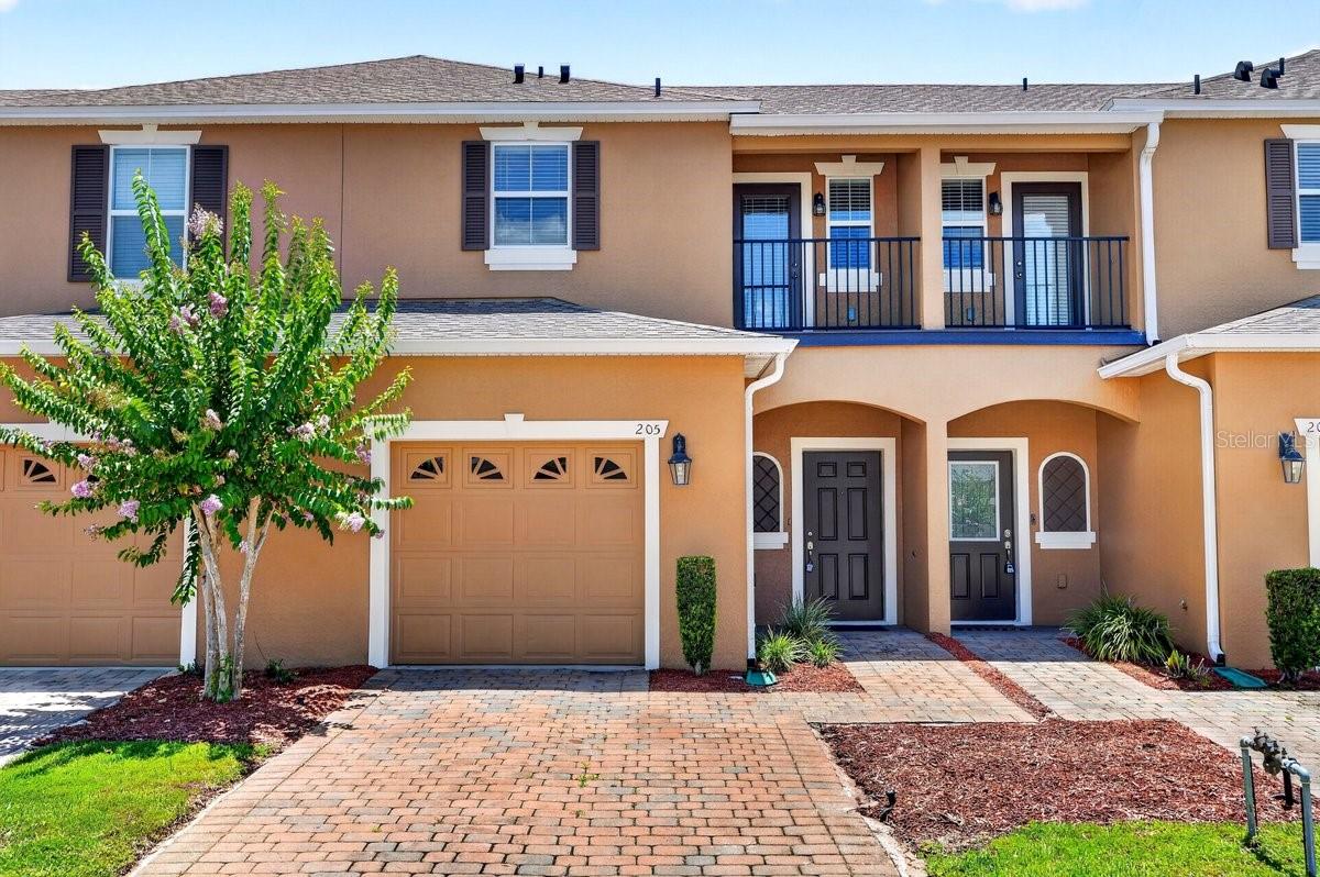 Virtually Staged. Move-in ready and impeccably maintained, this beautiful townhome in the highly desirable Grande Champion section of LPGA offers comfort, convenience, and an unbeatable location in the heart of Daytona Beach. Built in 2016, this immaculate 2-bedroom, 2.5-bath home features a highly sought-after floor plan with dual primary suites upstairs--each with its own private en-suite bathroom, making it ideal for roommates, guests, or multi-generational living. The open-concept first floor is designed for easy everyday living and entertaining, featuring spacious living and dining areas filled with natural light. The kitchen is beautifully appointed with granite countertops, stainless steel appliances, ample cabinetry, and great flow into the main living space. A convenient half bath downstairs adds extra functionality for guests.

Upstairs, you'll also find the laundry room conveniently located near both bedroom suites for maximum ease and efficiency. Step outside to your covered rear patio overlooking a maintenance-free lawn, offering a peaceful space to relax without the upkeep. Additional features include a 1-car garage and access to the community pool.

Located in the popular LPGA community, this home offers quick access to I-95, I-4, and International Speedway Boulevard, making commuting effortless. Just minutes from Embry-Riddle Aeronautical University, Daytona State College, world-famous beaches, shopping, dining, and entertainment. Easy access to Orlando makes this an ideal primary residence, second home, or investment opportunity. Low-maintenance living in one of Daytona Beach's most convenient locations--schedule your private showing today.