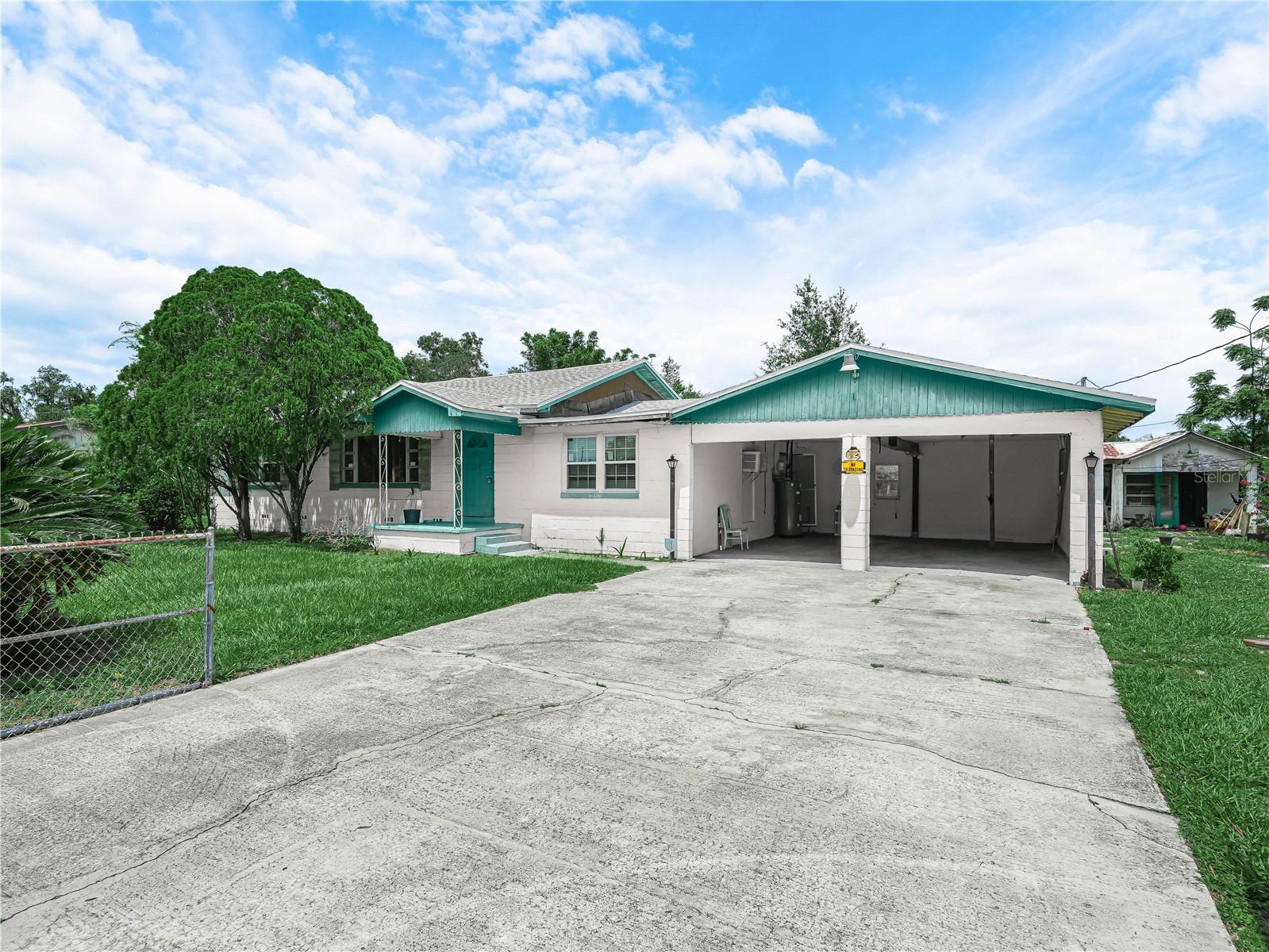 NO HOA! This sprawling 5 bedroom house would be perfect for a large family. The roof is only two years old and the HVAC was replaced in 2018. Kitchen has real wood cabinets, plenty of counter space and comes with all the appliances. The house has TWO adjacent dining rooms, so you can easily accommodate your extended family for holiday meals and special occasions! Next to the dining rooms you'll find a flex space that could be used as a computer room, study hall, you name it. There's a large living room plus a family room, and even a BONUS room. The spacious inside laundry room comes with a washer and dryer. Outside you'll find an adjacent two-car garage, and a two-car carport with workshop for all your projects. The yard is a third of acre in size and is fully chain-link fenced. With a new construction house across the street, and a few on the next block, the neighborhood is being redeveloped, so this home is in a prime location. The house is in need of a renovation, but qualifies for an FHA203k renovation loan. The title search has already been completed, which will fast-track closing on this purchase, so call now!