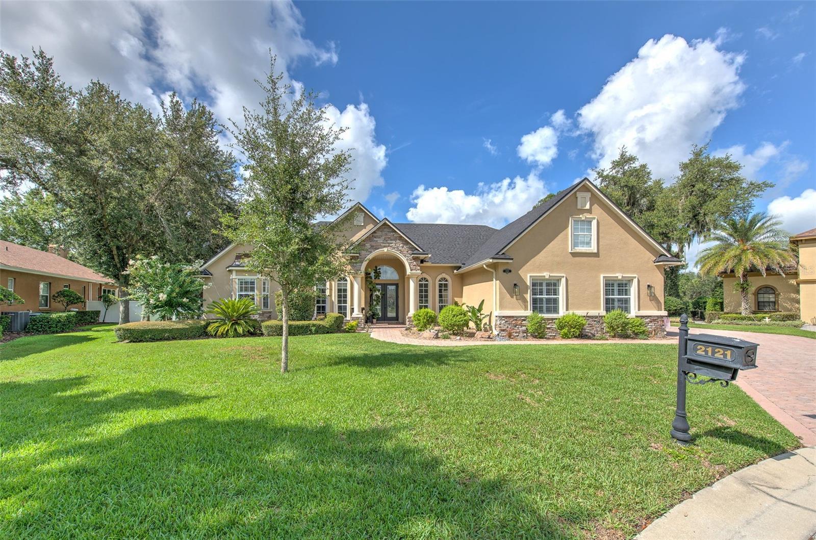 Luxury living in Lakeland, this one-of-a-kind 5-bedroom, 4-bath home on 1/2 acre in an exclusive 10-home gated community in one of the area’s most desirable locations.

Designed for comfort, entertaining, and multi-generational living, this spacious home includes a private detached mother-in-law suite with its own entrance. The split floor plan offers formal living and dining room, a bright family room, office/library, breakfast nook, and a well-appointed kitchen with granite countertops, wood cabinetry, new stainless steel appliances, and a large walk-in pantry. Additional features include wood and tile flooring, crown molding, plantation shutters, a decorative fireplace, custom door casings, and abundant storage throughout.

The primary suite features dual custom walk-in closets and a spa-style bath with a garden tub, separate walk-in shower, dual vanities and linen storage.

Upstairs, enjoy a 30’ x 12’ private home theater complete with theater equipment and a convenient half bath.

Outdoor living is exceptional with a screened paver pool enclosure featuring a 12’ x 24’ in-ground pool with child safety fence, plus a pergola-covered outdoor kitchen with built-in sink and BBQ grill. The fully fenced backyard also includes an 8’ x 10’ storage shed with paver floor and beautifully landscaped grounds.

Additional highlights include:

* Brand-new roof
* Solar panels
* New hot water heater
* 3-car garage with two openers
* Inside laundry room
* Whole-home sound system
* Outdoor television
* Ceiling fans throughout
* Granite countertops in all bathrooms
* In-ground sprinkler system
* Oversized paver driveway
* Large walk-in closets throughout

Conveniently located between Tampa and Orlando, this home is just minutes from George Jenkins High School, shopping, medical facilities, restaurants, and more.

Schedule your private showing today