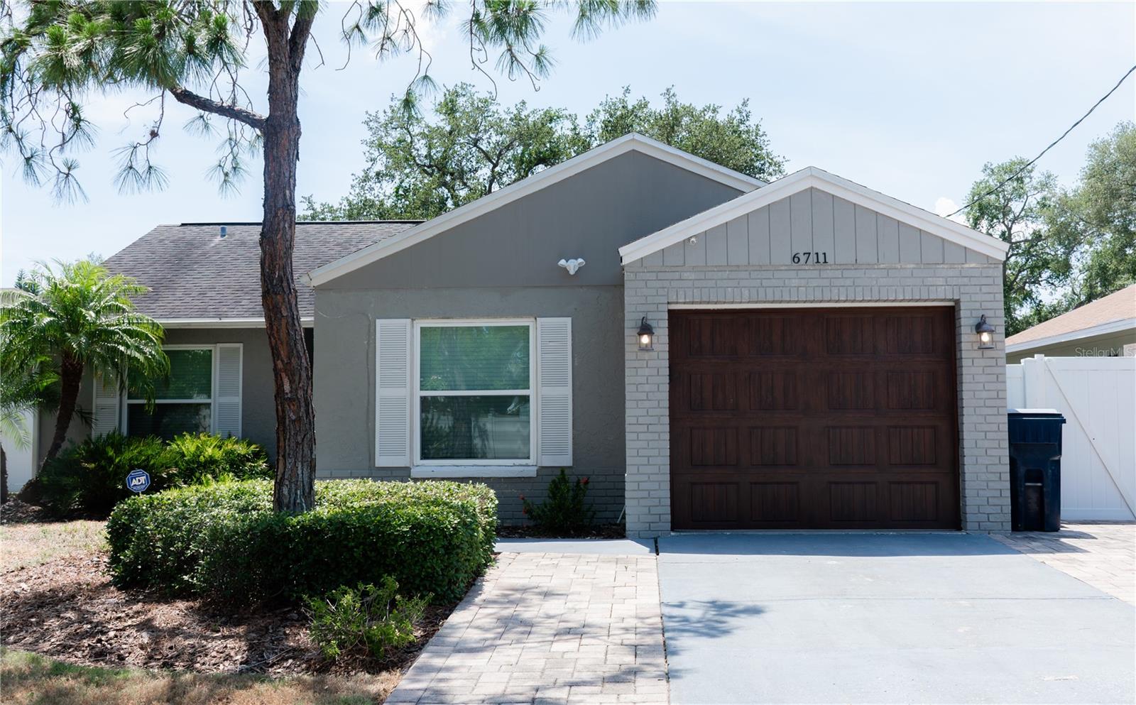 This is a South Tampa GEM!  3 bedrooms and 2 bathrooms with lots of closet space and a garage!!!  The back yard is fully fenced with plenty of patio space and green space!  It has upgraded impact resistant windows for additional security and hurricane preparedness.  
The home sits on a NON-through street that is quiet.  The home had no water during Helene or Milton (or any other storm for that matter!)  
There is a large living and dinning space that separates the split floorplan.  The Primary bedroom has a walk in shower with upgraded glass enclosure.  It has large closet and is just inside the Primary suite.  
The two additional bedrooms are off to the left of the living space both large enough for full size beds.  
On the other side of the living space there is a well appointed kitchen with all stainless appliances including a double oven.  The kitchen has a bar to the dinning area for easy entertaining.  
To the rear of the home is an additional living space that accesses the rear patio which is large and shaded in the mornings for a great place to drink your coffee!  The rear yard is large enough for plenty of play and lots of shade from the trees.  
The minimum requirements for this home are 650 credit score and 3xs the rent in income to qualify.  NO COSIGNERS!!