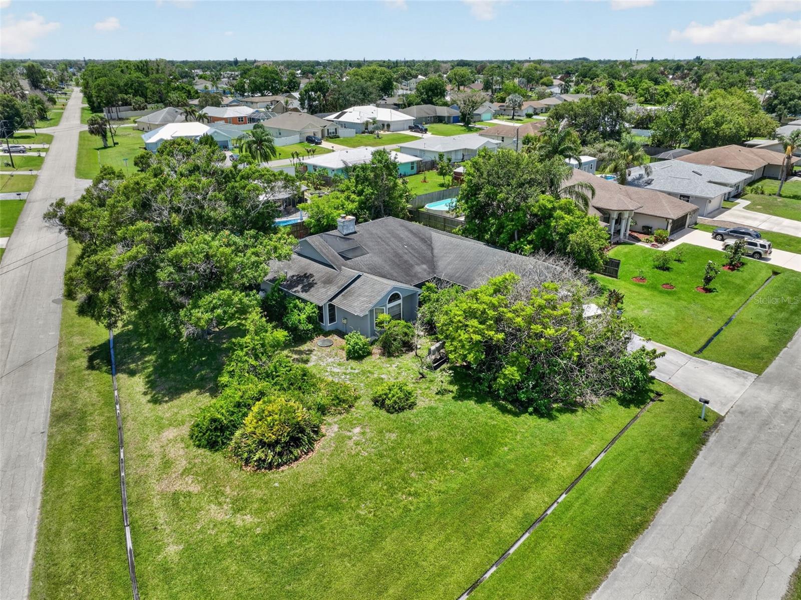 CASH ONLY OPPORTUNITY! Amazing chance to reimagine this sprawling ranch-style home on a beautiful treed corner lot in Port St. Lucie. Situated on approximately .35 acres, this spacious home offers over 2,200 sq. ft. of living space, a pool, and endless potential for the right buyer. Property is distressed and in need of a complete remodel, making this ideal for investors, builders, or buyers looking for a major renovation project. Cash purchase only due to condition. Multiple offers expected - submit highest & best. Sold AS IS. *************AGENTS READ ALL THE BROKER REMARKS*************