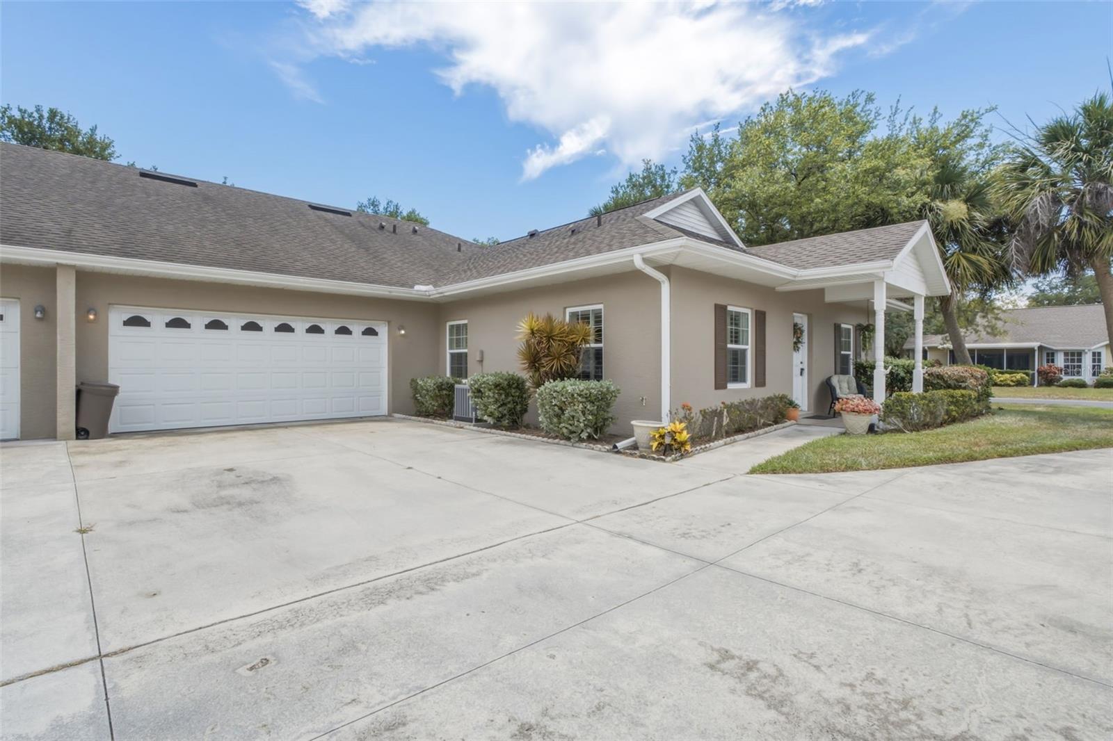 Welcome to this sought after "A' corner villa in the highly desirable Heritage Oak Park community. Surrounded by beautiful, lush landscaping, this impeccably maintained 2-bedroom, 2 -bath home offers exceptional curb appeal and a peaceful setting. It also features a private office with double door entry, making it ideal for working from home or accommodating guests. Inside, soaring ceilings and luxury laminate flooring throughout creates a bright, spacious, and inviting atmosphere. Every window is beautifully appointed with high-end wooden blinds, adding timeless style, warmth and privacy throughout the home. For added peace of mind, the home is equipped with hurricane impact windows and sliding doors. The enclosed lanai has been thoughtfully upgraded with premium windows, creating additional year-round living space that's perfect for relaxing, entertaining, or simply enjoying the serene surroundings. The spacious 2- car garage offers ample room for vehicles and storage. Residents of Heritage Oak Park enjoy outstanding amenities, including a heated community pool, tennis courts, and a large clubhouse featuring a card room, library and an active social calendar. Ideally located close to shopping, restaurants and medical facilities. This sought after villa offers the perfect combination of comfort, quality and maintenance-free living! Schedule your showing today!