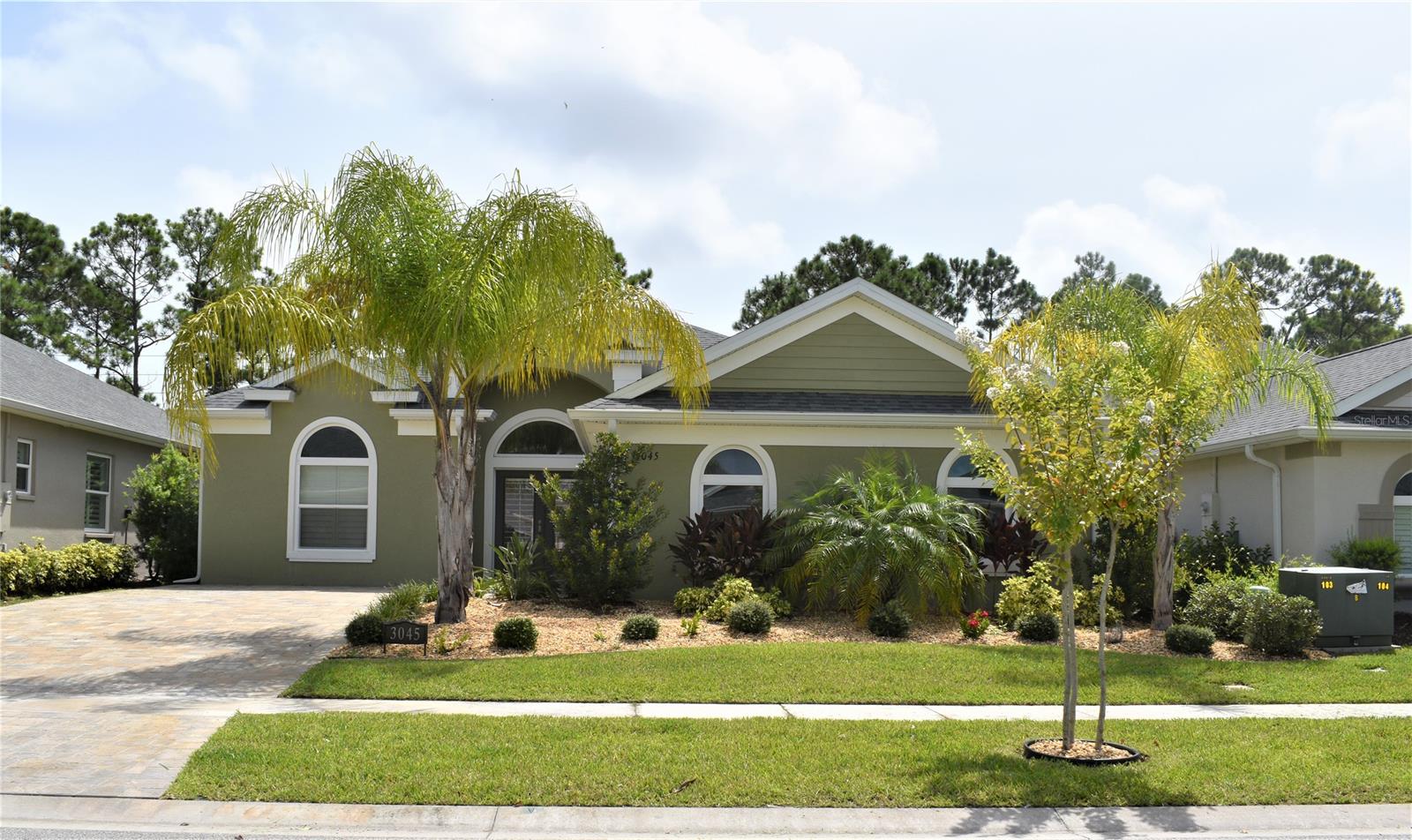 This Paytas built home's original Sago 3/2 floor plan was converted to a 2/2 floor plan for full handicap accessibility (if needed.) The Great room includes living, kitchen and dining rooms. Oversized double doors abound for convenience. Master bedroom has built-in chest of drawers and guest bedroom has built-in desk and Murphy bed. Home highlights include whole house generator with automatic throw switch, irrigation, screened patio, fenced yard, driveway pavers and sloped ramps at each exterior door. Conveniently located within fifteen minutes of downtown New Smyrna Beach that boasts fabulous restaurants and shopping. ;Water: City