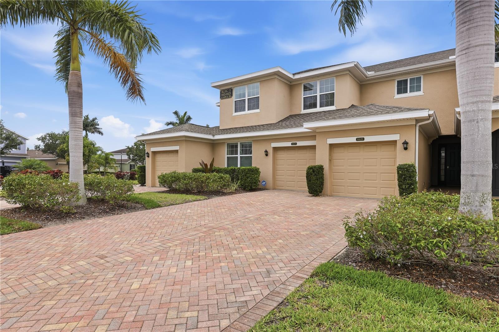 Welcome to this Beautiful Condo in the gated Palmer Oaks Community in Sarasota FL!  This Spacious 2-bedroom, 2-Bath home features an open-concept layout with soaring 9'4" Ceilings, elegant tiled floors, and elegant finishes throughout. The Kitchen is designed for both style and function with granite counter-tops, decorative back-splash, stainless steel appliances, large island with counter seating. Granite counter-tops continue into both bathrooms for a cohesive upscale feel. Washer and Dryer, window shutters are also included. Relax on the screened covered lanai overlooking a peaceful pond with a lighted fountain creating a perfect setting for morning coffee. Upgrades include Plantation Shutters throughout, epoxy-coated garage floor. Prime Sarasota Location just minutes from Siesta Key Beach, Legacy Trail, Golf Courses, Downtown Sarasota, Mall at University Town Center. Conveniently located right off I-75 with restaurants, entertainment nearby, Walmart 1 block away. This will not last Long!!!!!!