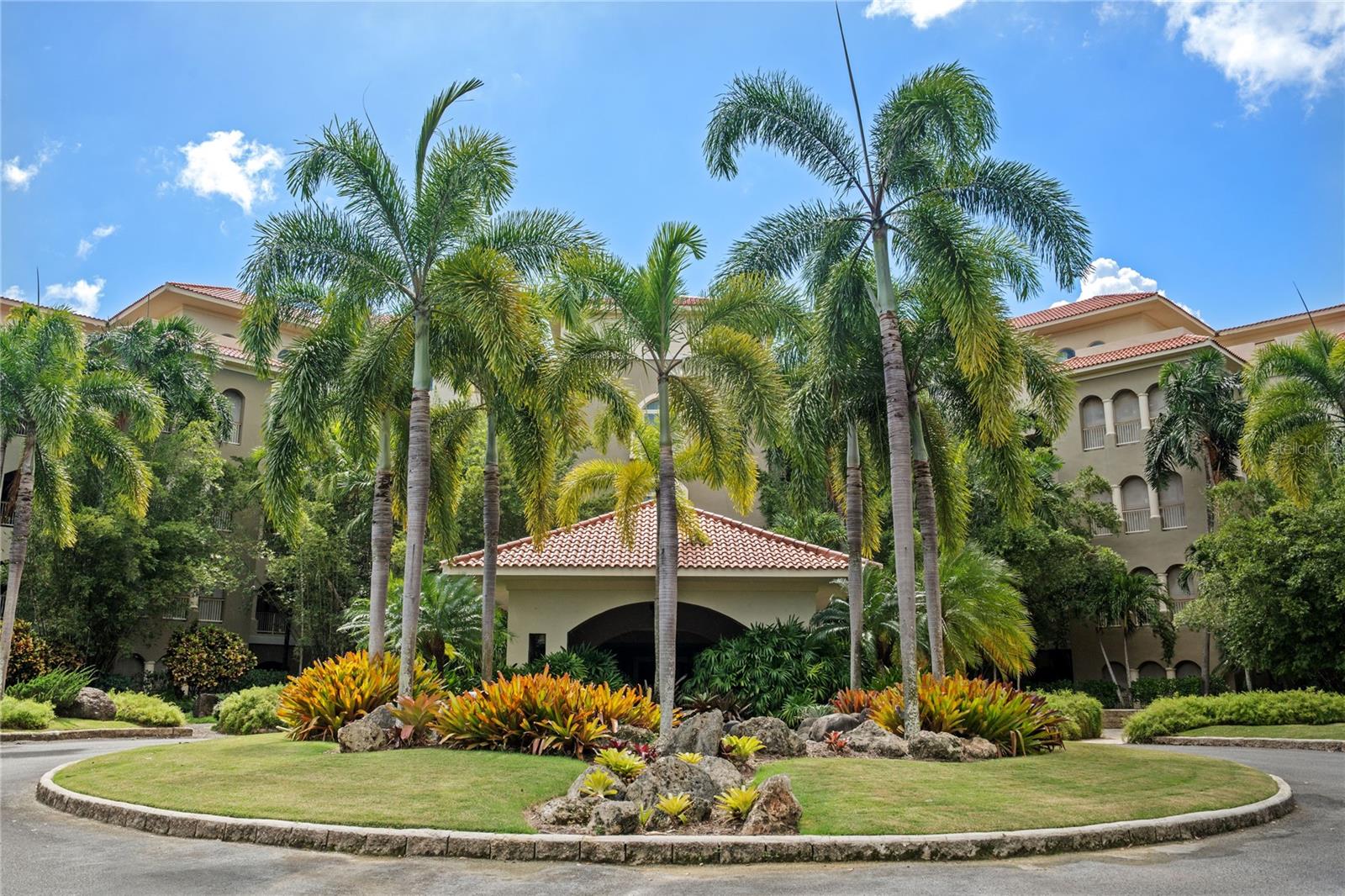 Plantation Village 3-208 offers a unique opportunity to own one of the coveted corner residences in Building 3—a second-story home defined by its expansive wrap-around terrace and serene elevated views. Set within the Dorado Beach Resort, this residence delivers a refined blend of indoor comfort and outdoor living, all within the exclusive community anchored by the Ritz-Carlton Reserve.
Designed for light, space, and privacy, this 3-bedroom, 3.5-bathroom condo, with 2,337 sq. ft. of living area, features multiple exposures, oversized windows, and an airy layout that opens directly onto its signature terrace. Enjoy direct terrace access from both the living room and the primary bedroom, creating a seamless connection between interior spaces and the expansive outdoor area. The property is offered turn-key, complete with furnishings, making it easy to enjoy from the moment you arrive.
Ownership in Plantation Village provides eligibility for the renowned Dorado Beach Resort membership, granting access to an unmatched collection of amenities: TPC golf courses, world-class beaches, tennis and pickleball facilities, members-only dining, multiple pools, the water park, a full fitness center, Encanto Beach Club, the Rockefeller Nature Trail, Spa Botánico, and the Barlovento beachfront experience.
Residents of Building 3 also benefit from dual elevators, 24/7 concierge and security services, pet-friendly policies, and full emergency backup systems maintained by the on-site management team.
A beautifully appointed home in one of Puerto Rico’s most exclusive neighborhoods, 3-208 is ready for immediate enjoyment. Contact us to schedule your private tour.