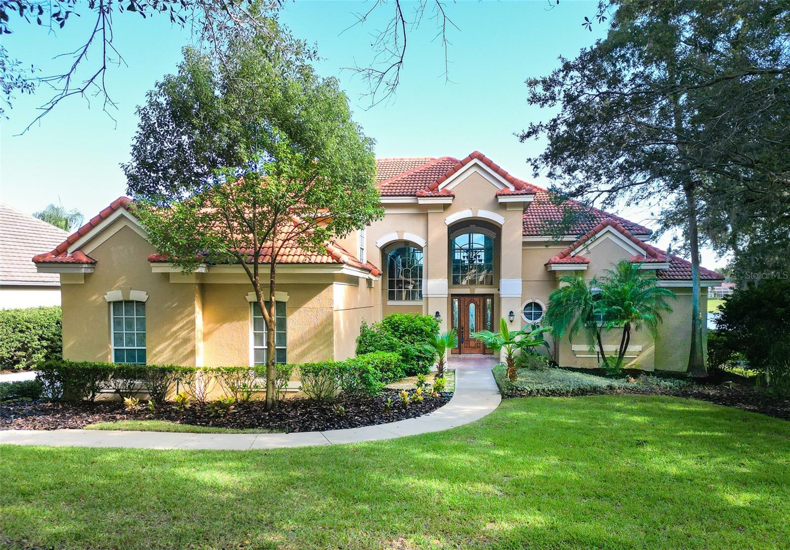 NEW ROOF TO BE INSTALLED!!! Welcome to luxurious living in the highly desirable, 24/7 guard gated community of Heathrow! Immediately upon entering your front door you will be greeted with breathtaking lakefront views. The screened patio is perfect for entertainment, equipped with a private pool bath and outdoor sink. With an oversized lot, there is ample space for outdoor fun by the lake. This 4 bedroom, 4 full bath and 2 half bath features a loft upstairs overlooking the lake for beautiful sunsets every night. Your primary bedroom is conveniently located on the first floor so you can always wake up to a stunning view of the lake each morning. This home features a side facing two car garage plus a dedicated garage for your golf cart. This home is zoned for A-rated Seminole County Schools: Heathrow Elementary, Markham Middle, and Seminole High School, all while being conveniently located to all shopping, dining, and highways. This property has been recently updated with new pool pump and water heater, two new HVACs, a new hot water heater, and fresh interior paint. And if that wasn’t enough, Heathrow Master HOA includes access to parks, baseball fields, soccer field, basketball courts & fishing! Plus there are additional memberships available for golf course and clubhouse fitness center as well as community pool and tennis courts too. Don't miss out on this amazing opportunity to live in one of Heathrow’s beautiful neighborhood of Stonebridge - schedule an appointment today!