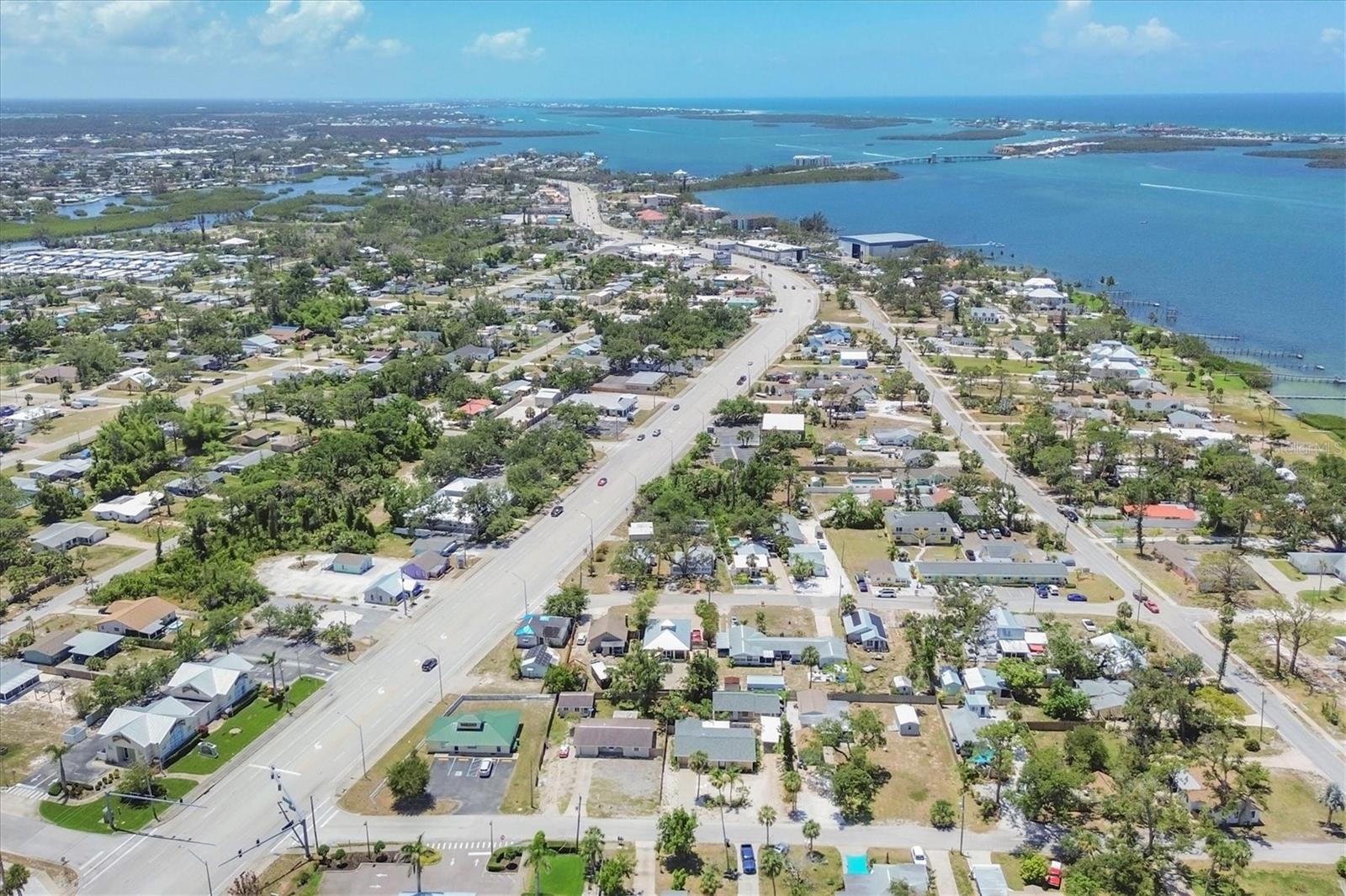Two Homes in Old Englewood: A Florida Paradise Awaits! Discover classic Florida charm at its finest with this well-loved property, ideally located just minutes from the vibrant Dearborn Street and beautiful Manasota Key! Pride of ownership shines through in the main house, which features 2 bedrooms and 2 baths, fully updated with tile flooring throughout. The spacious kitchen and abundant closet space make this home truly inviting. A versatile flex room adds more functionality, perfect as an office or guest room. Step outside to enjoy the beautiful garden, where blooming plumeria fill the air with their delightful fragrance—an enchanting reminder of the paradise you call home! Nestled at the back of the property is a charming cottage with 2 bedrooms and 1 bath. As you enter, you'll be captivated by the stunning pine ceilings that evoke a cozy beach vibe that carries through the cottage! The kitchen is open concept with tasteful solid wood cabinetry, tiled counters and newer appliances. The soothing wall color and tile flooring provide a fresh and inviting atmosphere. After a day of beachcombing for seashells, unwind in this delightful retreat. The cottage also features a privacy fence, a carport, and a covered outdoor area currently adorned with lounge furniture—perfect for savoring your morning coffee. Both homes are offered turn-key furnished, making it easy to move right in. The HVAC units and roofs for both properties were updated in recent years. This unique property is perfect for a multigenerational family or as an investment opportunity with excellent vacation rental potential. Being sold "AS IS," this gem won’t last long! Call today for your private showing and embrace the incredible lifestyle of this property!