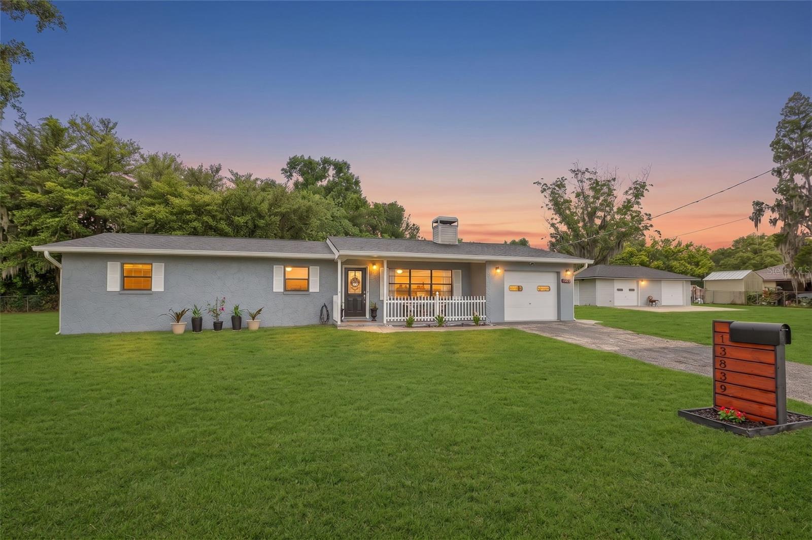 Wanna live in a small town, but get to the big city with ease? Start your summer off right in this country chic move-in ready home on a corner lot with over 1/3 of an acre. Charm overflows throughout this renovated block home featuring 4 bedrooms, two full bathrooms and a "Pinterest" perfect air conditioned sunroom which overlooks the fenced-in portion of the backyard where you can take a dip in the 9 foot by 18 foot above-ground pool, sunbathe in perfect privacy, host epic summertime barbecues, or roast marshmallows over the fire pit while stargazing under a clear country sky. Back inside, you'll find a spacious open floor plan with a modern coastal country vibe showcased by the custom wood planked fireplace with floating wood shelves and mantle. Enjoy cooking in the recently updated kitchen with granite counters, subway backsplash, and newer stainless steel appliances. This rural retreat also includes a 1 car attached garage with ample laundry space, a utility sink and exterior door which leads to one of this amazing home's most sought after features: a 20 foot by 40 foot detached double bay garage which houses the included riding lawn mower, a dedicated workshop space, built-in wood storage shelving throughout and an additional dual driveway. With NO HOA, NO CDD, NO community Karens or rules limiting what you can do on your land, and on private well water and septic system, you've hit the jackpot with this beautiful small town property. Centrally located between Tampa and Lakeland. Minutes from Highway 92, I-4, the Strawberry Festival, historical downtown Plant City and Keel & Curley Vineyard & Restaurant. Don't wait, start to embrace country living today with freedom and plenty of room for your family, friends and animals, alike.

RECENT UPGRADES AND RENOVATIONS INCLUDE THE FOLLOWING:
- 2026: Interior paint including kitchen cabinets and sunroom, kitchen cabinet hardware, dining room light fixture, landscaping, bath fixtures in both bathrooms
- 2025: NEW ROOF, NEW WATER HEATER, POOL including filter & pump installed, new exterior door in sunroom and attached garage
- 2024: Custom wood fencing and mailbox
- 2022: NEW HVAC INSULATION, 
- 2021: NEW HVAC ducts, septic pumped, water filtration chlorination purification treatment system installed, kitchen appliances, washer and dryer, 
- 2017: NEW HVAC