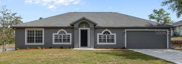 Discover refined Florida living in this beautifully appointed and spacious 4-bedroom, 2-bath residence, perfectly positioned on a premium corner lot. Elegant formal living and dining rooms welcome you into a thoughtfully designed open floor plan that balances sophistication with everyday comfort. The heart of the home is the chef-inspired kitchen, featuring gleaming granite countertops, a large center island, dual sinks, and stainless steel appliances. The kitchen opens effortlessly to a sunlit breakfast nook, where sliding glass doors invite you to step outside to your private resort-style retreat, complete with a stunning endless pool--ideal for exercising, relaxation and entertaining. Tile flooring flows throughout all living areas and into the expansive primary suite, creating a cohesive and luxurious feel. The primary suite is a true sanctuary, offering a generous and tasteful ensuite with a granite vanity, elegant tile shower, indulgent soaking tub, and a private water closet for enhanced comfort and privacy. With generous living spaces, upscale finishes, and an exceptional outdoor setting, this home offers timeless style, comfort, and the elevated lifestyle you've been searching for.