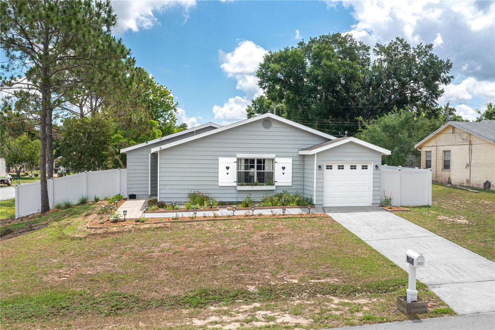 Discover the perfect blend of style and functionality in this meticulously updated Lakeland retreat, offering over 1,200 square feet of comfortable living space. This charming home features a desirable split-bedroom floor plan with two spacious bedrooms, two full bathrooms, and a versatile bonus room ideal for a home office or hobby space. The interior shines with consistent, high-quality laminate flooring throughout—no carpet—and a completely renovated kitchen showcasing elegant shaker cabinetry and sleek granite countertops. The large primary suite provides a private sanctuary with an updated en suite bathroom, while the second bedroom is situated on the opposite side of the home for maximum privacy. Both bathrooms have been tastefully refreshed with modern vanities and granite countertops. Step outside to enjoy the Florida lifestyle on the expansive 12x24 screened-in lanai, overlooking a generous, fully fenced quarter-acre lot secured by premium vinyl privacy fencing. The exterior is just as well-maintained as the interior, featuring beautiful landscaping with a dedicated drip irrigation system and the convenience of a single-car garage. With major systems already taken care of—including a roof replaced in 2018 and a brand-new AC system installed in 2022. This turnkey property is ready for its next owner to move right in and enjoy. Don't miss this opportunity to own a fully updated gem in a prime Lakeland location!