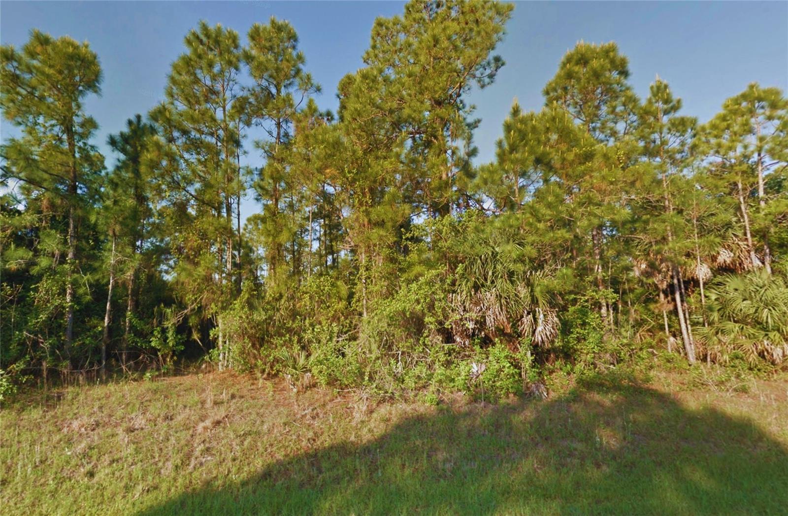 OWNER FINANCING AVAILABLE! This prime 0.23-acre buildable lot on Kimberly Dr in North Port, perfectly positioned in one of Southwest Florida’s fastest-growing areas. Located on a paved, city-maintained road with direct access, this property offers a clean slate for your future home or investment. Best of all, it sits outside of the flood zone and wetlands, giving you a major advantage when it comes to building, insurance, and long-term value.
Zoned AC6, this lot provides more flexibility than typical residential parcels, opening the door to multiple potential uses. Conveniently located near I-75 with easy access to North Port, Port Charlotte, and Sarasota, you’ll enjoy both privacy and proximity to everyday amenities, parks, and outdoor recreation. Whether you’re looking to build now or hold for future growth, this is a strong opportunity in a rapidly developing market. Buyer to verify all information with the county, including zoning, utilities, and suitability for their intended use.