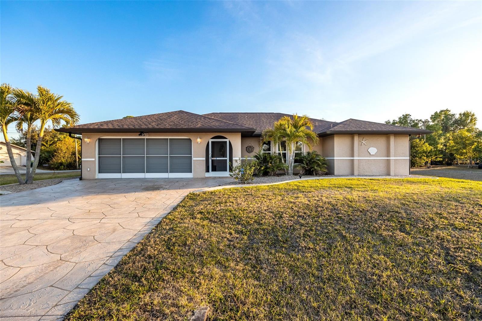 This beautifully maintained 3-bedroom, 2-bath home features an open floor plan with vaulted ceilings and abundant natural light from an elegant skylight. A formal living room welcomes you, while the spacious family room flows seamlessly into the fully renovated kitchen (2017), complete with granite countertops, under-mount sink, tile backsplash, pendant and recessed lighting, extended breakfast bar, and built-in desk—perfect for everyday living and entertaining. The primary suite offers a peaceful retreat with a custom feature wall and private sliding door access to the patio, and the en-suite bath includes dual vanities and a dedicated makeup area. Secondary bedrooms provide flexibility for guests, a home office, or hobby space. Outdoor living truly shines with an oversized screened-in pool area accessible through extended sliders, a covered lanai ideal for relaxing or hosting gatherings, plus a gazebo and fire pit that create the perfect backyard retreat. AN ADDITIONAL BUILDABLE LOT is included, bringing the total property size to .66 acres and offering added privacy or future possibilities (seller would consider a sale without this spare lot resulting in a lower sales price). Recent updates and upgrades include a new roof with impact-rated skylight (2021), Storm Smart impact windows and hurricane shutters, solar panels (reduce electricity costs and heat the pool), Pebble Tec pool resurfacing (2022), whole-house generator with underground propane tank (2023), full home re-pipe (2023), whole-house water filtration system, new water softener, new air conditioner, and a 190-ft well with fully automated Rainbird irrigation. This move-in-ready meticulously maintained home offers comfort, efficiency, and exceptional Florida living. NO HOA, restrictions, or flood insurance needed (FLOOD ZONE X)