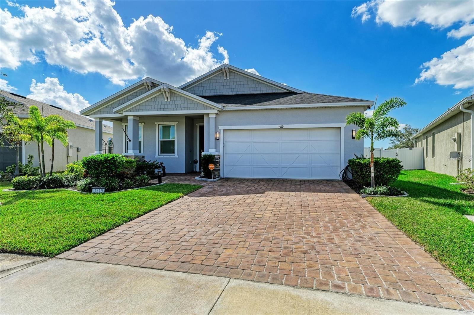 One or more photo(s) has been virtually staged. A stunning and spacious 4-bedroom, 3 full bathroom home located in the desirable community of Grady Pointe, offering the perfect blend of comfort, style, and convenience. Seller's lender does NOT require flood insurance! 

This prime central location offers unmatched accessibility—just minutes from IMG Academy and a short drive to the world-renowned beaches of Siesta Key and Anna Maria Island. Enjoy easy access to Lakewood Ranch, I-75, U.S. Route 301, U.S. 41, and premier shopping and dining at University Town Center. Also, a quick 7 minute ride to Sarasota Airport!

Thoughtfully designed with an extended floorplan, this home offers exceptional flexibility for families and guests alike. Step inside to an open-concept layout highlighted by soaring 9-foot ceilings, creating a bright and inviting atmosphere throughout. The chef-inspired kitchen is a true centerpiece, featuring quartz countertops, upgraded appliances, and ample space for entertaining. Premium vinyl flooring flows seamlessly through the main living areas, combining durability with modern elegance.

The spacious 2-car garage provides plenty of room for vehicles and additional storage. Outdoors, enjoy a screened-in lanai—perfect for relaxing or entertaining year-round—overlooking a private, fully fenced backyard with serene lake views and breathtaking sunset skies.

Grady Pointe is a newer, well-maintained community offering a range of amenities including walking trails, a park, pickleball courts, and a dog park. Residents enjoy a peaceful, friendly neighborhood atmosphere complemented by low HOA fees.

Constructed with solid block construction for lasting durability, this home also includes hurricane shutters and has remained resilient through recent storms, offering added peace of mind.

Move-in ready and beautifully maintained, this home delivers modern living in an exceptional location. Schedule your private showing today and experience it for yourself.