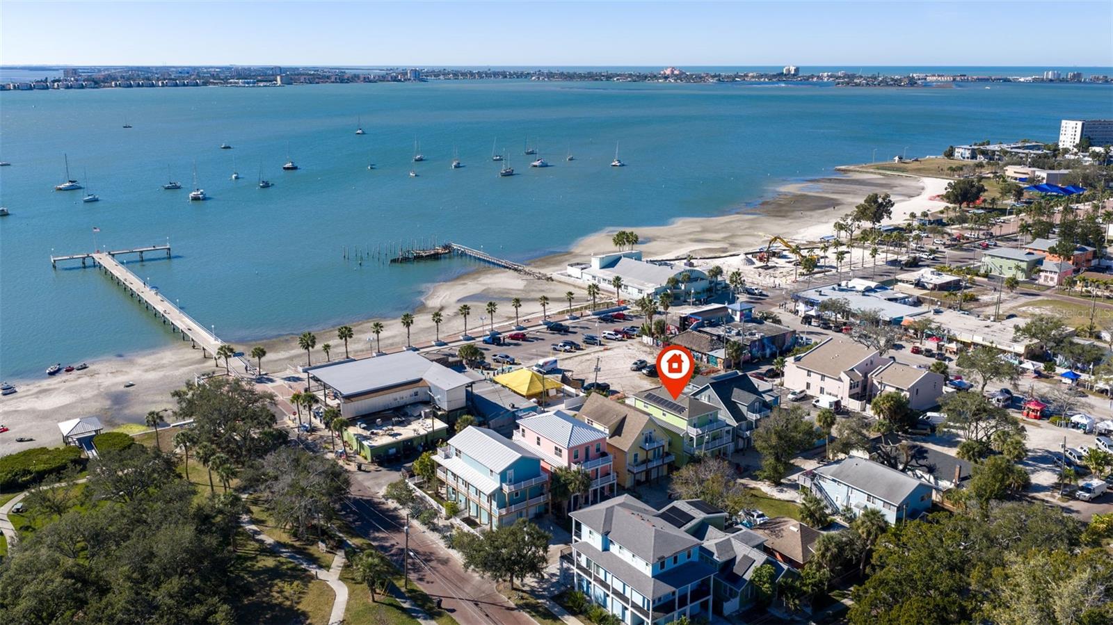 Short-Term Rental investment opportunity in the heart of Gulfport’s Historic Art District! This fully furnished, Key West-inspired coastal retreat offers short-term vacation rental potential, breathtaking Boca Ciega Bay views, and an unbeatable walkable location just steps from downtown Gulfport’s restaurants, galleries, waterfront parks, nightlife, and popular Tuesday Farmers Market. Whether you’re seeking a high-performing Airbnb/VRBO property, second home, or full-time waterfront residence, this exceptional home delivers the perfect combination of lifestyle and income-producing potential. Guests and owners alike will love the private outdoor living spaces with panoramic water views overlooking Veteran’s Park—ideal for morning coffee, sunset cocktails, and entertaining in true Florida style. Inside, coastal elegance meets modern luxury with an open-concept layout designed for comfort and hosting. The gourmet kitchen features stone countertops, extensive cabinetry, abundant storage, and premium finishes perfect for entertaining vacation guests or everyday living. The luxurious primary suite serves as a private sanctuary with a professionally designed walk-in closet system and a spa-inspired ensuite bath complete with a whirlpool tub, dual vanities, and oversized enclosed shower. The third floor features private outdoor decks off the primary, second, and third bedrooms, offering incredible sunset views and refreshing coastal breezes that make Gulfport one of Tampa Bay’s most beloved waterfront communities. Built for durability, efficiency, and low-maintenance ownership, the home includes an elevator, impact-rated windows, Hardie plank siding, Trex decking, turf landscaping, and a whole-home solar system for significantly reduced electric costs. The oversized two-car garage provides ample room for vehicles, kayaks, jet skis, beach gear, or additional owner storage. Located just minutes from Downtown St. Petersburg, award-winning Gulf beaches, marinas, and Tampa Bay attractions, this rare turnkey short-term rental property is ready to generate income immediately while offering an incredible waterfront lifestyle. Opportunities like this in Gulfport’s Historic Waterfront District are exceptionally rare.