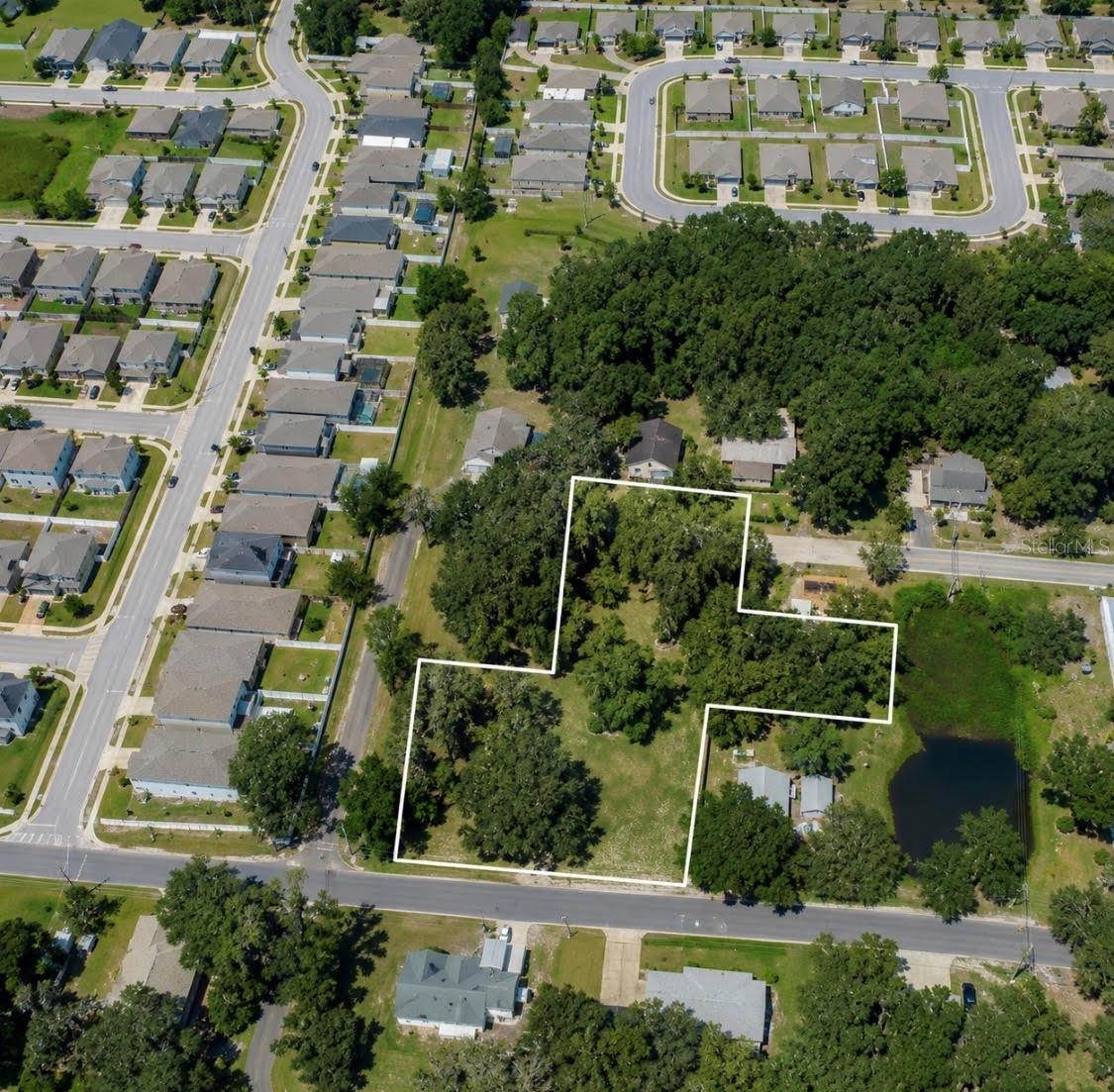 Located in the City of Mount Dora! Over 1 Acre with Potential for 4 Building Lots! Rare opportunity to own a prime vacant parcel in the highly desirable golf cart district of downtown Mount Dora. This unique property offers frontage on two separate streets and is serviced by city water and sewer. With the potential to subdivide into up to four building lots, the possibilities are endless for investors, builders, or those looking to create a private estate. Enjoy all that charming downtown Mount Dora has to offer, including shopping, dining, festivals, and waterfront parks—all accessible by golf cart. Recently recognized among the Top 10 Small Towns in America, Mount Dora continues to attract residents and visitors alike. Don't miss this exceptional opportunity to invest in one of Central Florida's most sought-after communities!