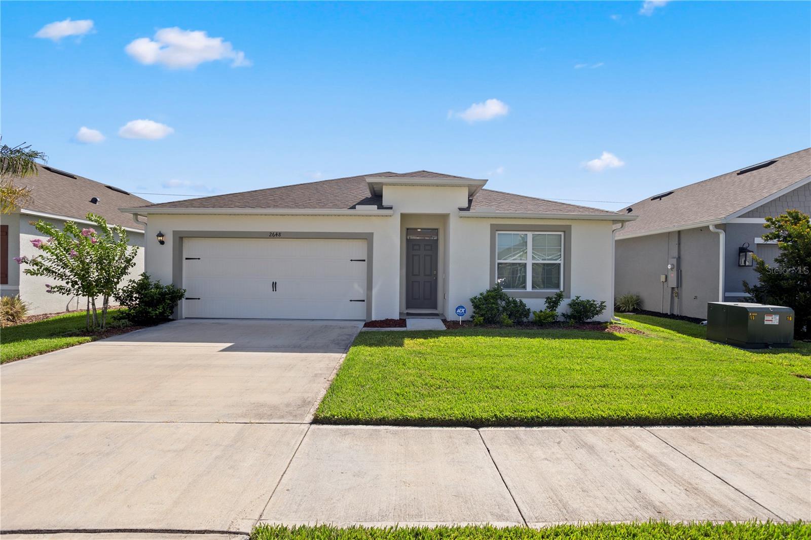 Welcome to Coastal Woods! This move-in ready Cali floor plan checks all the boxes with 4 bedrooms, 2 bathrooms, and a smart, open concept layout that makes everyday living and entertaining feel effortless. The kitchen is the heart of the home featuring a spacious island, stainless steel appliances, and a large pantry, all open to the living and dining areas. Step outside to your screened-in patio overlooking a fully fenced backyard with three fruit trees already in the ground and gutters already added, both solid upgrades not every home in the community offers. The primary suite is tucked away at the back of the home for privacy, complete with a double vanity, walk-in shower/tub combo, and a generous walk-in closet. Three additional bedrooms and a full second bath are toward the front of the home, giving everyone their own space. And the best part? This home comes fully furnished. Move in, unpack your bags, and you’re home. All concrete block construction, city water, and the Home is Connected smart home package round out this well-built home in New Smyrna Beach. Schedule your showing today.