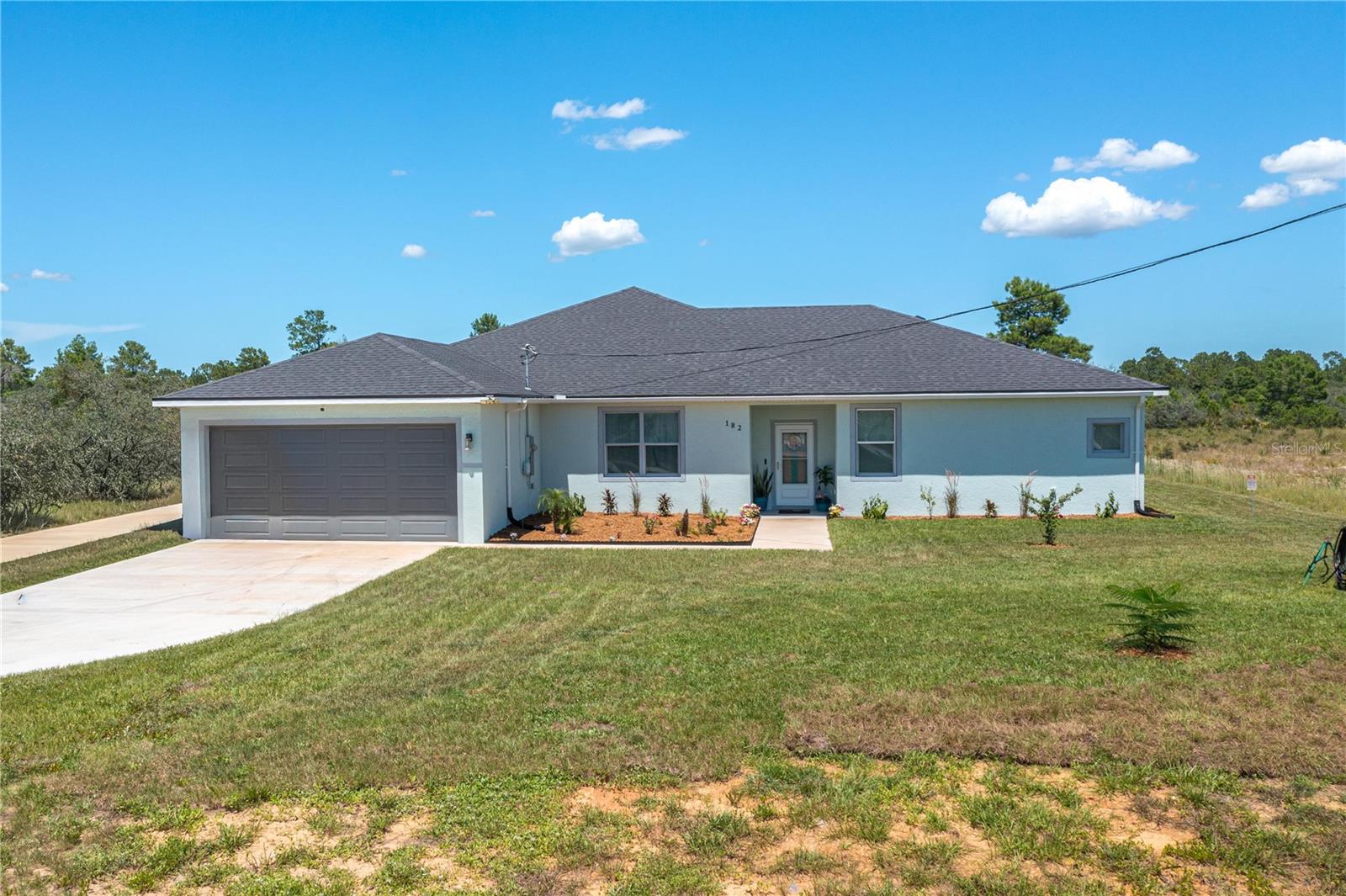 Bring the whole family—this one-of-a-kind property truly has it all! Situated on a sprawling 1-acre lot, you'll find **two custom-built homes** connected by a breezeway, making it perfect for multi-generational living, guests, or rental opportunities.

The primary residence features **4 bedrooms, 3 bathrooms**, formal living and dining rooms, a spacious family room, a beautifully designed kitchen with a large island, walk-in pantry, and an inside laundry room. Need additional space? The office includes a walk-in closet and can easily serve as a fifth bedroom.

The second home offers **2 bedrooms, 2 bathrooms**, an inviting open-concept floor plan, its own 2-car garage, and a screened patio—providing comfort and privacy for family or visitors.

Both homes are loaded with custom features, each offering a 2-car garage and screened patio. Step outside and you'll discover your own private shooting range, plus plenty of room to add a pool, workshop, barn, or whatever you've been dreaming of.

Best of all, there's **NO HOA and NO CDD!** Enjoy peaceful country living while remaining conveniently close to shopping, dining, and everyday amenities. Located just **8 minutes from Warner University**, this exceptional property offers the perfect blend of space, flexibility, and convenience.

If this is for an MLS listing, I can also make it more keyword-rich and optimized to attract buyers while staying within MLS character limits.