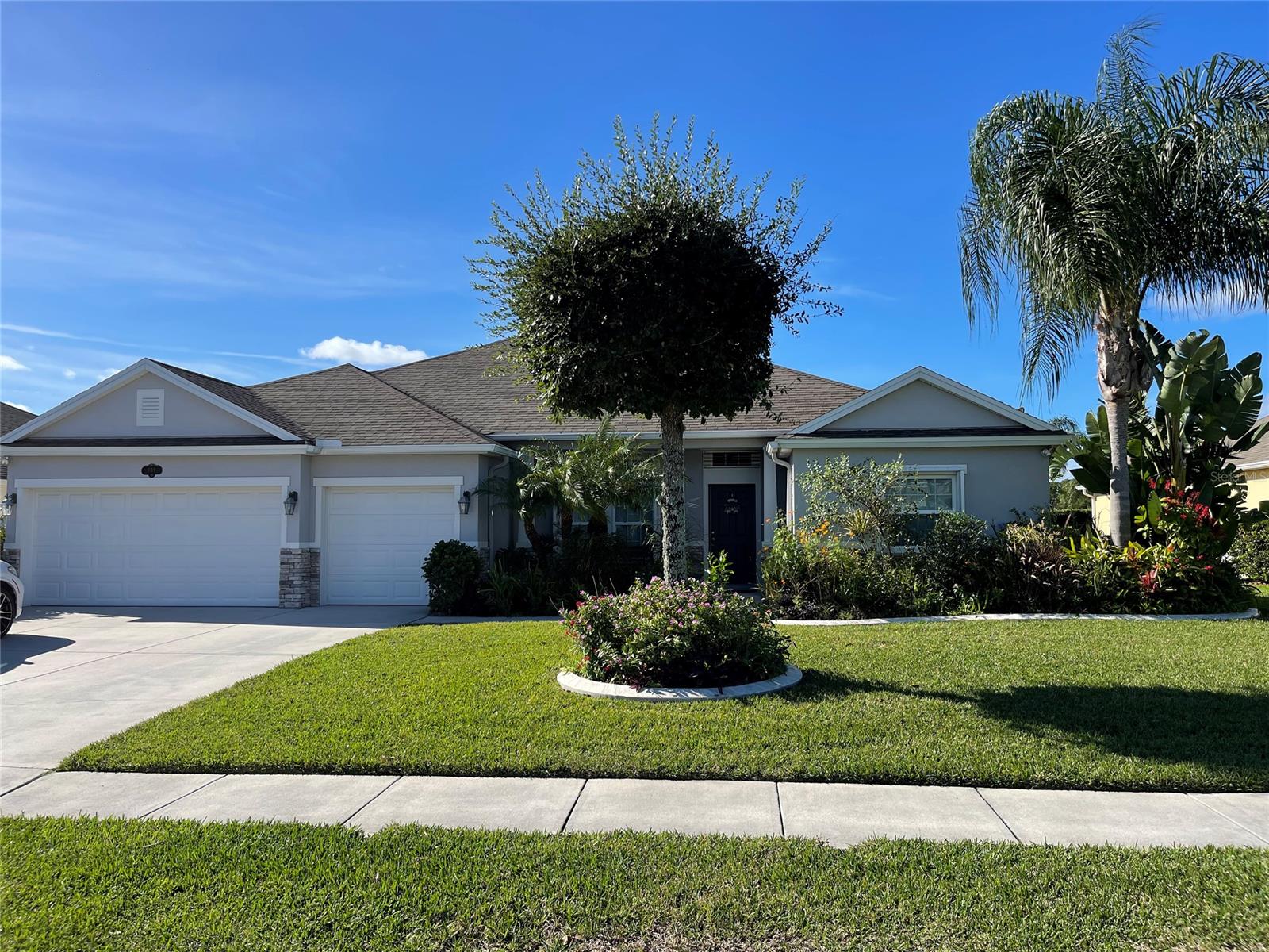STUNNING HOME IN DESIRABLE SUGAR MILL GARDENS! Completed in 2013, this spacious home offers 4 bedrooms, 3 baths, 3 car garage, and large screened in lanai. This home features a split floorplan, recessed lighting, 9' ceilings, large walk-in closets, and granite counter tops in the kitchen with custom cabinet pull outs and a large pantry. Fourth Bedroom offers private ensuite bathroom. Fabulous master retreat with tray ceilings, a sitting room, 2 walk in closets, and a master bath offering 2 vanities, a garden tub, and a large walk in shower. Exterior motion detection lighting and fruit trees. Close to the beach, shopping, and dining. This well cared for home will not last long! ;Water: City