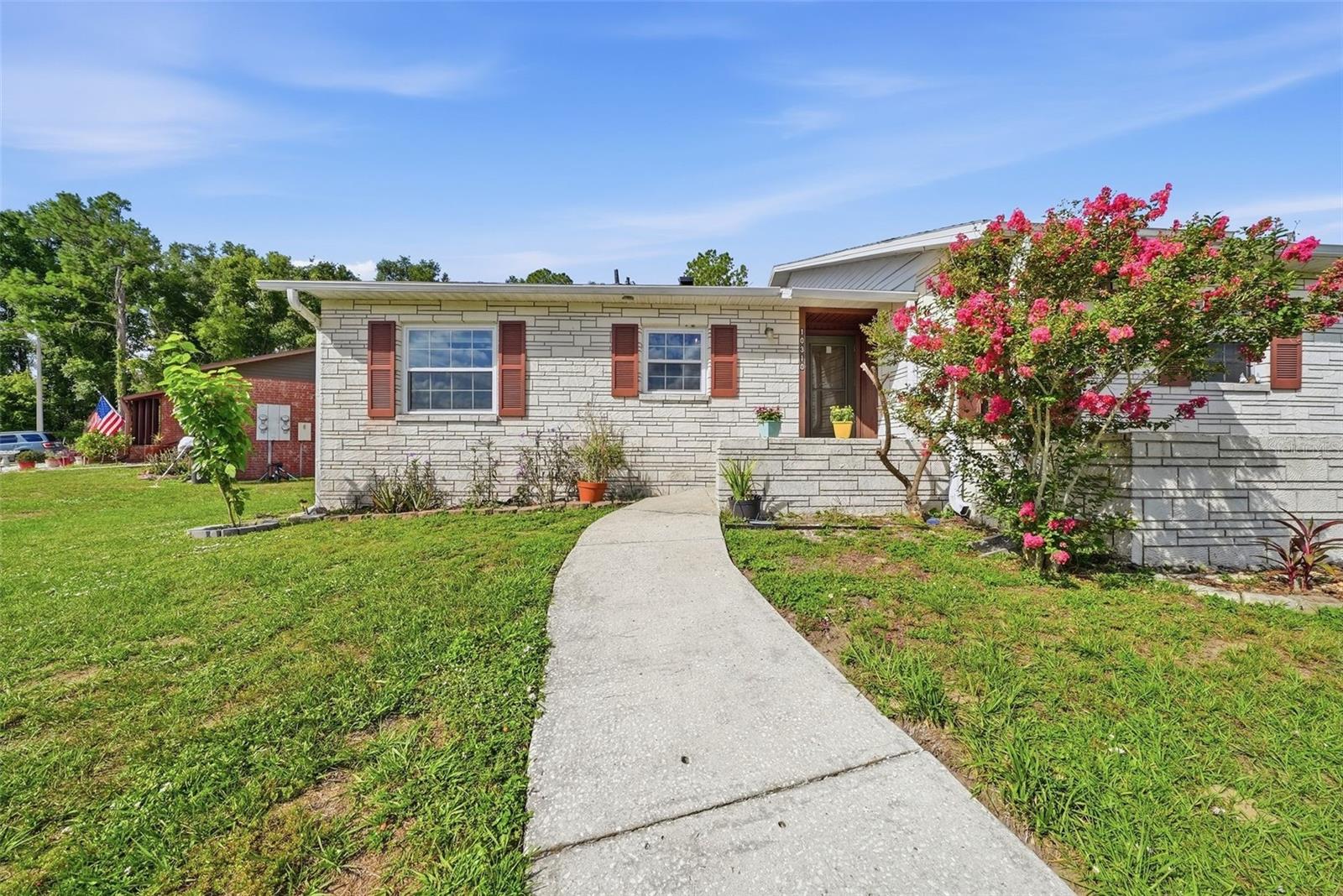 Affordable, Adorable & Move-In Ready! Welcome home to this charming 2-bedroom, 1-bath villa-styled condo in a convenient East Tampa location. Whether you're a first-time homebuyer, downsizing, or looking for a smart investment opportunity, this beautifully updated home offers exceptional value with low HOA fees and numerous recent upgrades. Step inside to discover stylish and durable wood-look porcelain tile flooring (2025), an updated kitchen with maximized storage, butcher block countertops (2023), and a renovated bathroom (2023) designed for modern living. Sunlight floods through the open kitchen into the dining/living areas. Major system improvements provide peace of mind, including all new windows (2023), washer and dryer (2024), tankless water heater (2025), and air handler replacement (2025). Enjoy the convenience of two dedicated parking spaces, a screened in rear porch, and low-maintenance living. The HOA is just $195 a month and covers water, trash, exterior maintenance, roof, and lawn care, making homeownership both simple and effortless. The community has also invested in its future with a new well pump installed in 2024 and a new well reservoir completed in 2026. The building's roof was replaced by HOA in 2020. Don't miss this opportunity to own an updated, affordable villa in a central location that is just 15mins away to shopping, dining, major highways, and everything Tampa has to offer. All this and a non-flood zone area. Call your agent now and schedule your viewing today!