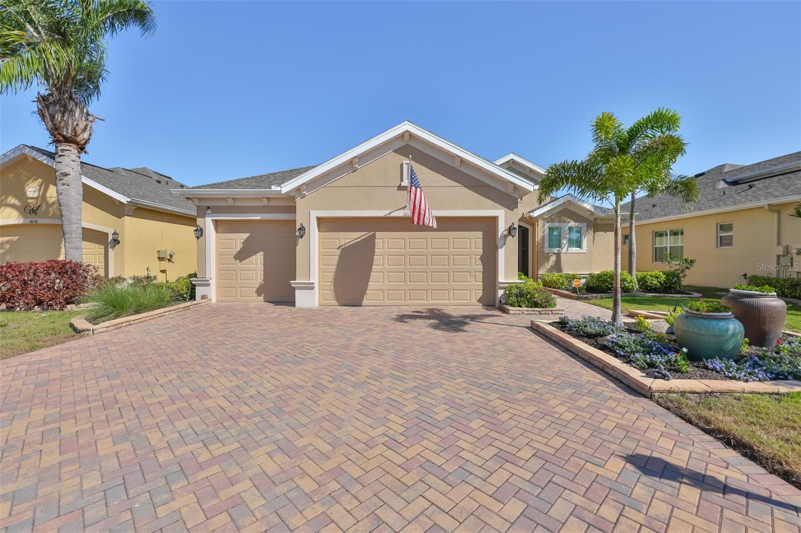 Experience refined Florida living in the 55+ GOLF CART FRIENDLY community of Sun City Center, nestled within the prestigious golf course community of THE RENAISSANCE. Overlooking the 8th fairway, this impressive residence blends scenic beauty with thoughtful upgrades and timeless style. From the moment you arrive, the brick paver driveway, decorative landscape borders, and tropical plantings create striking curb appeal. Step inside to discover refined details like rounded archways, tray ceilings, crown molding, and a neutral palette that sets a warm, elegant tone.  Designed with entertaining in mind, this home features formal living and dining rooms along with a convenient half-bath for guests. An expansive, UPDATED KITCHEN showcases today's most sought-after designs and finishes, effortlessly flowing into the family room and bright dinette.  The spacious owner's suite is fully appointed with two walk-in closets, a soaking tub, and-best of all-split vanities. Your guest suite is privately situated on the opposite side of the home, complete with its own en-suite bath and walk-in closet.  Notable features include: 12/2022 ROOF**2025 HVAC**NEW KITCHEN APLIANCES**PLANTATION SHUTTERS**GUTTER GUARD**WATER SOFTENER**WHOLE HOUSE FILTRATION**  Additional highlights include a spacious 3-car garage with EPOXY FLOORING and built-in storage, as well as an EXTENDED, COVERED brick paver lanai-perfect for relaxing while enjoying the serene golf course and water view.  Just a short golf cart ride away, Club Renaissance offers dining, drinks, social events, fitness classes, Spa Celeste, and a resort-style pool. Residents also enjoy access to all Sun City Center amenities, including over 100+ clubs, pickleball, indoor and outdoor pools, tennis, volleyball, lawn bowling and MORE!  Don't miss the opportunity to experience this exceptional home!  Schedule your visit today and see why you'll want to make it yours!