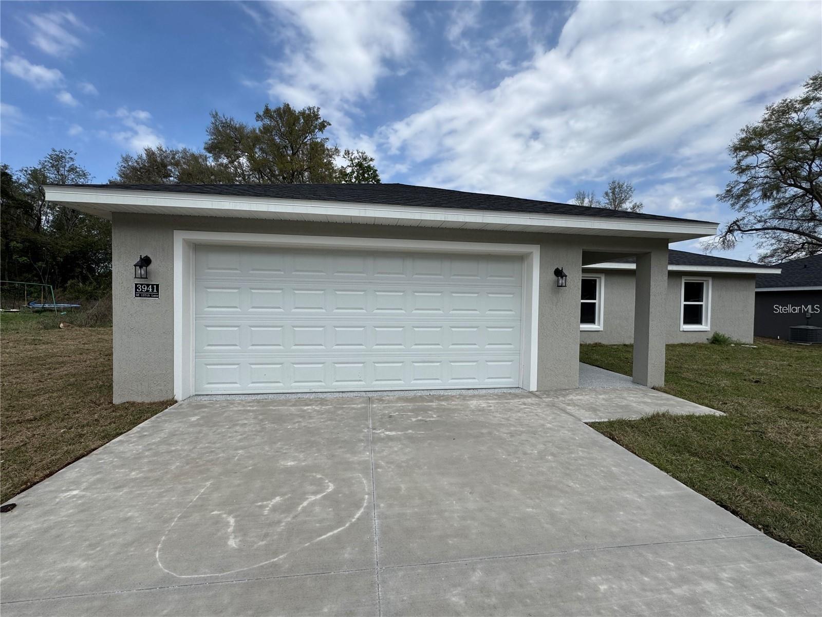 Brand-New Construction Home! Featuring a sought-after split floor plan and 2-car garage, this home offers an open-concept design with high ceilings, luxury vinyl plank flooring, upgraded lighting, and modern ceiling fans throughout. The corner lot provides added privacy, yard space, and enhanced curb appeal. The kitchen is equipped with stainless steel appliances, stone countertops, and upgraded cabinetry, all overlooking the spacious living and dining areas. The primary suite features a tray ceiling, walk-in closet, and a private ensuite bath with double vanities and a tiled walk-in shower. Guest bedrooms have generous closet space and abundant natural light. The guest bathroom includes stone countertops and a tiled tub surround. Enjoy the covered front entry, as well as sliding glass doors leading to the patio and backyard—perfect for relaxing or entertaining.Don't miss this beautiful new home—schedule your private showing today!