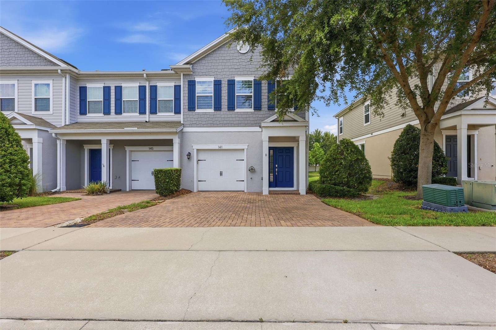 Welcome to this beautifully maintained 3-bedroom, 2.5-bath townhome nestled within the GATED community of Mitchell Creek in the heart of Oviedo. This highly sought-after END-UNIT offers exceptional privacy with NO REAR NEIGHBORS, tranquil POND VIEWS, and an abundance of natural light thanks to additional windows found only in end-unit residences. The home features a one-car garage and an extended paver driveway with space for two additional vehicles. Move-in ready and thoughtfully updated, this home boasts NEW LUXURY VINYL FLOORING throughout the main level with NO CARPET. Luxury vinyl and tile flooring extend throughout the entire home, creating a stylish, low-maintenance living environment. The light and bright interior color palette enhances the open-concept design, while matching light-gray cabinets and quartz countertops throughout the kitchen and bathrooms create a cohesive, modern aesthetic. The kitchen seamlessly flows into the living and dining areas, making it ideal for both everyday living and entertaining. Features include 42-inch cabinetry, quartz countertops, stainless steel appliances, a large center island with generous bar seating, and plenty of workspace for meal preparation and gatherings. Upstairs, the spacious Owner’s Suite serves as a private retreat, complete with a WALK-IN CLOSET and an en-suite bathroom featuring dual vanities, quartz countertops, a walk-in shower, linen closet, and separate water closet. Two additional bedrooms offer beautiful natural light and picturesque pond views, while a full guest bathroom also showcases coordinating quartz countertops and provides comfort and convenience for family, guests, or a home office setup. Triple sliding glass doors lead to the SCREENED IN AND COVERED LANAI, where you'll enjoy peaceful WATER VIEWS and outdoor living year-round. The lanai has been enhanced with a ceiling fan and NEW EPOXY FLOORING, creating the perfect spot to relax with your morning coffee or unwind at the end of the day. Residents of Mitchell Creek enjoy access to community amenities, including a resort-style POOL and PLAYGROUND, both just a short walk from the home. Located within a TOP-RATED SEMINOLE COUNTY SCHOOL DISTRICT and convenient to UCF, major highways, medical facilities, shopping, dining, and Oviedo on the Park, this property offers the perfect blend of comfort, style and convenience. Don't miss this opportunity to own one of Oviedo's most desirable townhomes in a prime location with top-rated Oviedo schools, community amenities, and beautiful pond views!