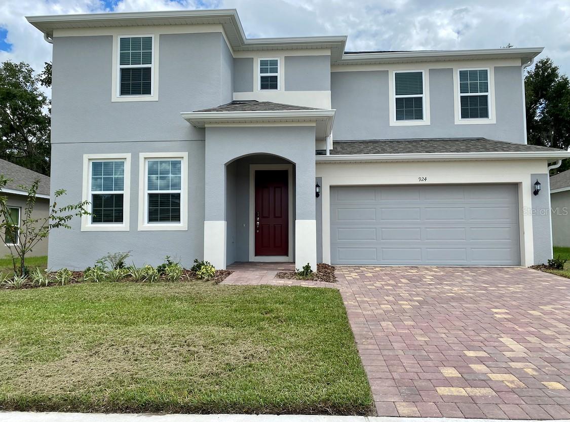 Constructed in 2022 Spacious Single-Family Home has 3219 Sq Ft in a gated community. This cozy home features 5 bed, 3 bath and a loft. The open kitchen has trendy Solid Wood Cabinet(42” Uppers), Quartz Countertop, Stainless Steel Appliances, A Big Single sink with Garbage Disposal, and Refrigerator with water/ice dispenser. LG washer and Dryer are on the second floor. Tile throughout the traffic areas of first floor for easy maintenance. A full bath and a guest bedroom downstairs. Second floor Master suite has a walk-in closet, double sink vanity, a tub, and a shower with frameless glass door and water temperature control. Loft on the second floor is good for a second family entertaining. Faux Wood Blinds for all window coverings.  Energy Efficient windows and 15 SEERS Heat Pump HVAC keep your electricity bill low. Two-Car Garage has epoxy finished floor. Huge rear yard for family activities and an additional playground in the community. Minutes to Walt Disney Parks, HWY 4, and Airport. Rent includes HOA fee.
