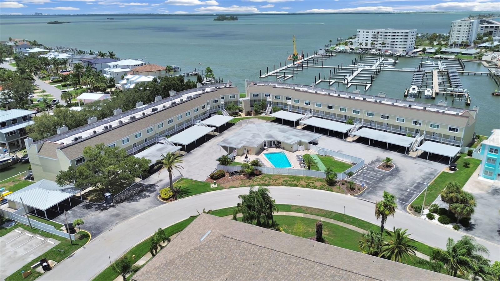 Welcome to your new light-filled waterfront retreat on the breathtaking Dunedin Causeway! This beautifully updated condo offers the perfect blend of coastal elegance and effortless Florida living. Featuring luxury vinyl plank flooring, stunning granite countertops, crisp white Shaker-style cabinetry with soft-close doors and drawers, and gleaming stainless steel appliances, this home is both stylish and functional.
The open-concept kitchen and living area create a warm and inviting space perfect for everyday living and entertaining. The oversized kitchen island provides ample workspace and serves as the perfect gathering spot. The living room opens to your balcony overlooking an intracoastal canal, where dolphins, manatees, sea turtles, and otters are often seen enjoying the tranquil waters. Electric panel and cast irons pipes have been updated/replaced

Step onto the sun-dappled balcony, breathe in the fresh salt air, and take in breathtaking panoramic sunsets over the water. A perfect place to relax and enjoy the beauty of Florida's endless horizons.

Upstairs, you'll find two spacious bedrooms, each featuring its own ensuite bathroom for privacy and convenience. Both bedrooms offer generous wall-to-wall closets and beautiful picture windows that bring in natural light. The windows and sliding glass doors were upgraded to hurricane-grade in 2018, providing added peace of mind.

Enjoy resort-style amenities with a sparkling saltwater pool, perfect for unwinding after a day at the beach. The clubhouse is currently undergoing renovations, adding to the community's future appeal.

Located on the iconic Dunedin Causeway, this home places you just minutes from the crown jewel of the area, award winning Honeymoon Island State Park! Enjoy pristine white sand beaches, nature trails, picnic pavilions, playgrounds, and even a dog-friendly beach. Experience the best of waterfront living, outdoor adventure, and the laid-back coastal lifestyle Dunedin is famous for.