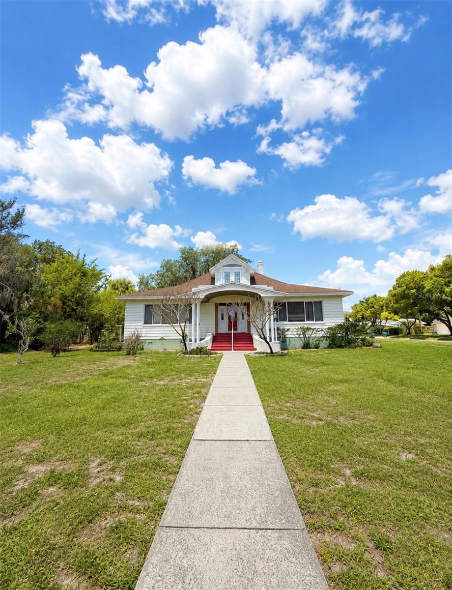 Lakefront historic beauty centrally located with nearly 3,000 sqft of spacious living area! Enjoy evenings and weekends boating or jet skiing on popular Lake Wailes. This timeless home showcases 12-foot ceilings, classic architectural details, and a striking staircase that anchors the main living space. Large windows frame stunning lake views and fill the home with natural light.

The layout includes spacious bedrooms, each with its own bathroom, and a second-floor loft ideal for an office, library, or bonus space. A private entrance leads to a bedroom, bathroom, and sitting area, offering excellent potential for a mother-in-law suite, guest quarters, or multi-generational living.

A 2019 roof adds peace of mind, while the detached garage with an additional bathroom provides added functionality. Ideally located near downtown, parks, shopping, and scenic walking paths.