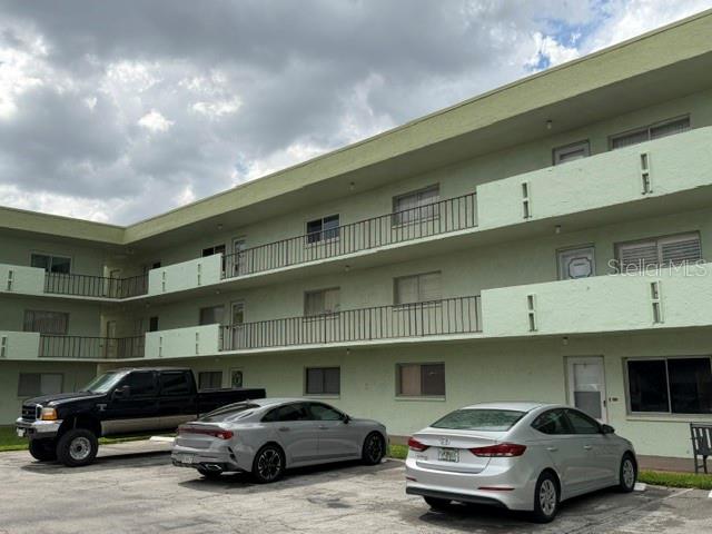 POOL-VIEW CONDO IN A WATERFRONT 55+ COMMUNITY! Bring your decorating ideas and make this spacious second-floor, 2-bedroom, 2-bath condominium your own. Unit A-208 offers a comfortable living and dining area, a generously sized primary bedroom, two full bathrooms, abundant storage, an in-unit laundry area and an enclosed Florida room overlooking the community pool. The galley-style kitchen provides plenty of cabinetry and counter space, while the flexible floor plan offers excellent potential for seasonal or year-round living. This home is ready for updated flooring and personal touches, giving the next owner an opportunity to choose the finishes and style they prefer rather than paying a premium for someone else’s renovations. Lakeside Village is an established 55+ community located on Lake Parker and features a community pool, clubhouse, shuffleboard and a peaceful waterfront deck where residents can relax and enjoy Florida lakefront living. Conveniently located near shopping, restaurants, medical facilities and everything Winter Haven has to offer. Priced with the updates in mind—come see the space, the pool view and the possibilities!