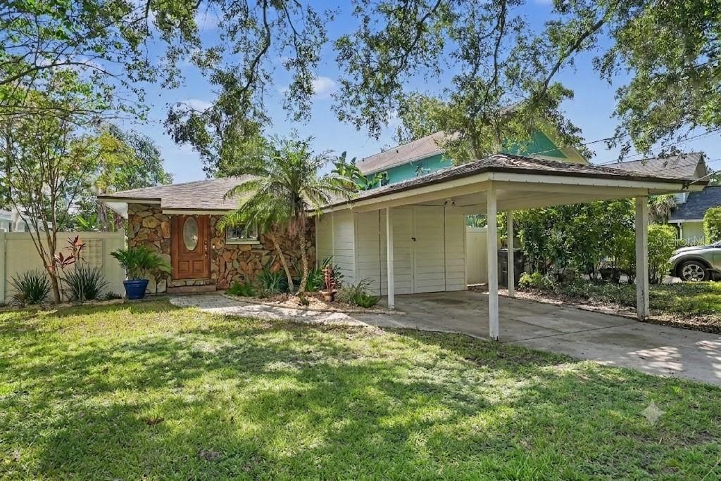 MOVE-IN READY TAMPA WATERFRONT HOME UNDER $300K! Escape to your own private oasis on LAKE DOROTHY located in the highly sought-after FOREST HILLS neighborhood. This 3-bedroom retreat offers unbeatable tranquility and central convenience with ultimate freedom and savings thanks to NO HOA, zero deed restrictions and a highly desirable NON-FLOOD ZONE (Zone X). Enjoy financial peace of mind with major upgrades already completed, including a brand-new ELECTRICAL PANEL (2026), HVAC SYSTEM (2022), and ROOF REPLACEMENT (2020). Inside, the updated eat-in kitchen features solid GRANITE COUNTERTOPS and custom built-in cabinetry. Just steps out the side door, you will find a massive, dedicated utility room—giving you abundant extra storage and a quiet, out-of-the-way laundry setup. Beautiful OAK WOOD FLOORING spans the main living areas, transitioning to clean LAMINATE FLOORING in the bedrooms, with absolutely NO CARPET throughout. Step through the bedroom’s sliding glass or French doors onto your covered wooden back deck. This outdoor living space overlooks an expansive backyard with 35 feet of direct water frontage on LAKE DOROTHY, perfect for launching a kayak, paddleboarding, or bass fishing right from your own backyard. LOCATION! Situated in the heart of Tampa's highly desirable Forest Hills area, you are perfectly positioned just minutes from I-275, providing rapid access to DOWNTOWN TAMPA, the USF MEDICAL DISTRICT, and all your everyday shopping and dining essentials.
