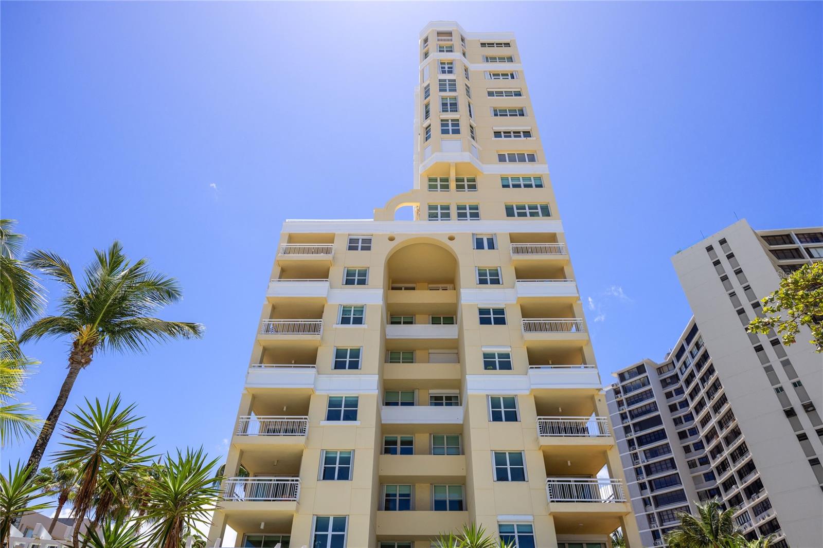 One or more photo(s) has been virtually staged. Perched on the 15th floor of the beachfront Carrion Court Playa Condominium, this exceptional residence showcases breathtaking ocean views throughout the home. Ideally located on the highly sought-after, gated street of Carrion Court, the property offers both privacy and prime beachfront living.

Spanning approximately 1,591 square feet, the apartment features 3 bedrooms and 2.5 bathrooms, thoughtfully distributed for both comfort and functionality. The open-concept living and dining areas seamlessly extend to a spacious balcony, creating the perfect setting to enjoy panoramic ocean vistas and coastal breezes.

The enclosed kitchen is conveniently positioned adjacent to the living areas and offers direct access to the balcony—ideal for both everyday living and entertaining. Elegant marble flooring and refined lighting fixtures add an elevated touch throughout the residence.

All bedrooms are enhanced with custom-designed closets featuring automated lighting. The unit has also been upgraded with new hurricane-resistant windows and balcony doors.

Carrion Court Playa is uniquely situated on the only gated street in the area and offers a full suite of premium amenities, including 24/7 security, dual full-capacity backup generators, a water cistern, heated pool, a playground, fitness center, activity room, and conference room. Residents enjoy direct beach access, providing a true coastal lifestyle—whether it’s morning walks along the shore, swimming in the ocean, or simply relaxing by the water.

The unit has 2 designated parking spaces.