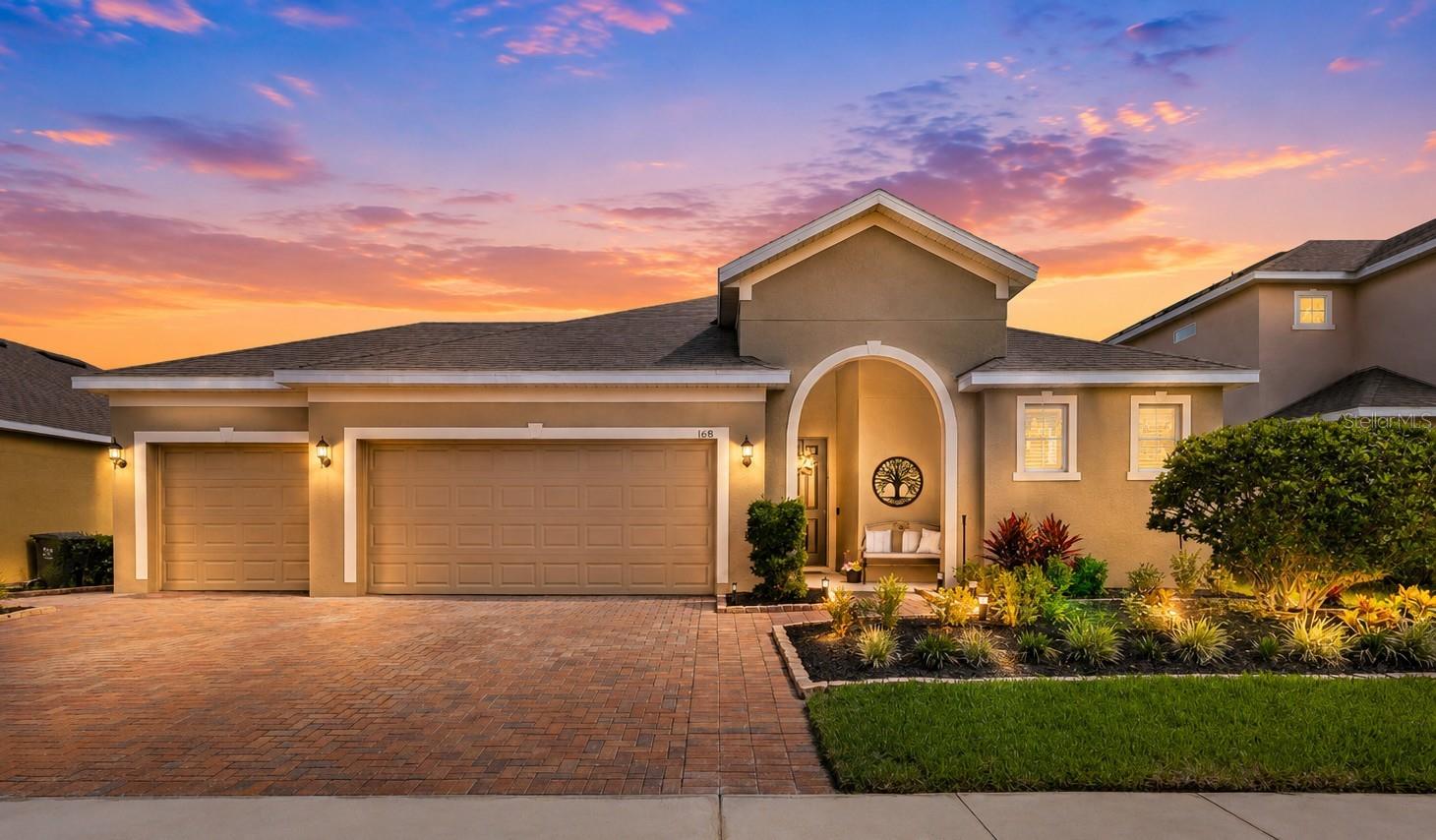Live where others vacation and enjoy a home designed for comfort, style, and everyday living! This beautifully maintained 4-bedroom, 2-bath home offers an open-concept layout, thoughtful upgrades, and a fantastic Davenport location close to Orlando's world-famous attractions, dining, shopping, golf courses, and entertainment.

Step inside to discover gorgeous waterproof Pergo flooring flowing throughout the living areas and bedrooms, creating a seamless, carpet-free living experience. The heart of the home is the spacious kitchen featuring granite countertops, stainless steel appliances, abundant cabinetry, a walk-in pantry, breakfast bar seating, and an open design that keeps everyone connected.

The inviting great room is sure to impress with soaring ceilings and a stunning custom stone feature wall complete with an electric fireplace, creating the perfect backdrop for relaxing evenings or entertaining guests. The adjacent dining area offers plenty of space for gatherings while maintaining the home's bright and open feel.

Retreat to the primary suite featuring a spacious bedroom, walk-in closet, and an ensuite bath with dual sinks, a relaxing garden tub, and separate shower. Three additional bedrooms and a secondary bath provide flexibility for family, guests, hobbies, or a home office.

Outside, the Florida lifestyle continues with a covered lanai that creates the perfect spot for morning coffee, outdoor dining, or relaxing in the shade. A convenient paver walkway along the side yard seamlessly connects the front and backyard, adding both charm and functionality. The fully fenced backyard has been thoughtfully enhanced with fresh landscaping, decorative planting beds, and a custom fire pit gathering area that invites friends and family to pull up a chair and unwind. With plenty of room for pets, play, gardening, or future outdoor additions, this backyard offers both beauty and versatility for year-round enjoyment.

Additional highlights include a 3-car garage, custom garage storage and workspace area with cement countertops.

Living here gives access to community amenities including a pool and playground while being ideally situated near major highways for easy access to Orlando, Disney, Universal Studios, championship golf courses, shopping, restaurants, and Central Florida's many attractions.

Come discover why so many people choose Davenport—where everyday living feels like a vacation.
