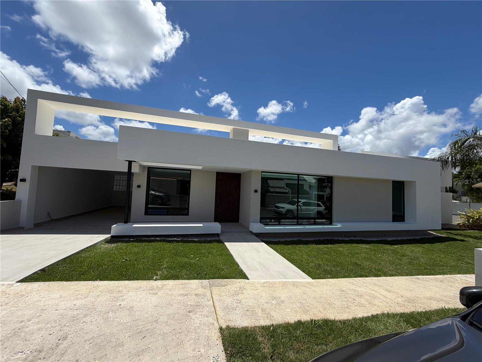 Stunning contemporary residence located in Urb.San Francisco, San Juan. This exceptional property offers approximately 5,000 sf of construction on an 807 sqm lot, showcasing clean architectural lines, open-concept living and abundant natural light  throughout. floor-to-celling windows seamlessly connect the interior spaces with the outdoor area creating a true indoor-outdoor living experience. The home features a private pool, spacious areas ideal for entertaining, high ceilings and minimalist finishes that enhance its modern aesthetic. Centrally located with easy access to major roads, top schools, hospitals, and shopping centers. A rare opportunity to own modern design residence in one San Juan's most convenient location