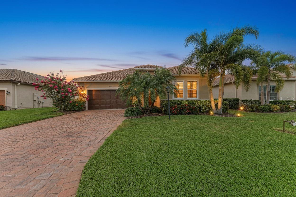 Meticulously maintained and beautifully updated, this move-in ready Ashton Woods Lazio model offers the perfect combination of comfort, convenience, and low-maintenance Florida living. Located in the maintenance-free section of Rosedale Golf & Country Club, residents enjoy lawn care, cable TV, and high-speed internet included, along with the added benefit of NO CDD fees, making this home an exceptional value in one of Lakewood Ranch's most sought-after gated communities.  Featuring 3 bedrooms, 2 bathrooms, and nearly 1,700 square feet of thoughtfully designed living space, the bright open floor plan is ideal for both everyday living and entertaining. Fresh coastal-inspired paint, updated lighting, new ceiling fans, and luxury vinyl plank flooring throughout all bedrooms create a light and inviting atmosphere, while tile flooring throughout the main living areas means there is no carpet anywhere in the home.

The kitchen serves as the centerpiece of the home with quartz countertops, a large island, 42-inch shaker-style cabinetry, designer backsplash, stainless steel appliances, gas range, and plenty of space to gather with family and friends. The spacious primary suite features a tray ceiling, walk-in closet, and refreshed ensuite bath, while two additional bedrooms provide flexibility for guests, a home office, or hobbies. One of the home's most exciting features is the opportunity to create your own custom outdoor retreat. The covered lanai enjoys private landscaped views with a peek of the water and is already pre-plumbed and wired for an outdoor kitchen. The home is also pre-wired for a future pool and spa, giving the next owner a head start on transforming the backyard into the Florida oasis they've been dreaming about. Additional features include hurricane screens for all windows, an impact glass front window, tankless water heater, irrigation system, in-wall pest control system with ongoing quarterly service, semi-annual HVAC maintenance, and washer and dryer included. Life in Rosedale is about more than just the home. Residents enjoy a staffed gatehouse entrance, Junior Olympic heated pool, fitness center, tennis courts, clubhouse, restaurant and bar, dog parks, golf cart-friendly streets, and optional golf memberships. Surrounded by mature landscaping, scenic lakes, and beautifully maintained grounds, Rosedale offers a resort-style lifestyle just minutes from Lakewood Ranch's shopping, dining, entertainment, and the Gulf Coast's world-famous beaches. This meticulously maintained home offers the ideal combination of comfort, convenience, and resort-style living. Schedule your private showing today.