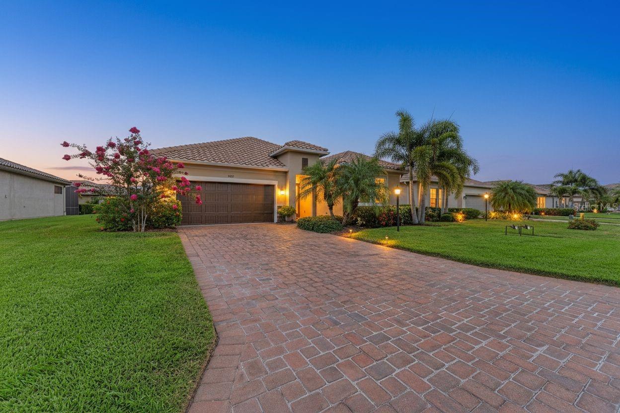 Meticulously maintained and beautifully updated, this move-in ready Ashton Woods Lazio model offers the perfect combination of comfort, convenience, and low-maintenance Florida living. Located in the maintenance-free section of Rosedale Golf & Country Club, residents enjoy lawn care, cable TV, and high-speed internet included, along with the added benefit of NO CDD fees, making this home an exceptional value in one of Lakewood Ranch's most sought-after gated communities.  Featuring 3 bedrooms, 2 bathrooms, and nearly 1,700 square feet of thoughtfully designed living space, the bright open floor plan is ideal for both everyday living and entertaining. Fresh coastal-inspired paint, updated lighting, new ceiling fans, and luxury vinyl plank flooring throughout all bedrooms create a light and inviting atmosphere, while tile flooring throughout the main living areas means there is no carpet anywhere in the home.

The kitchen serves as the centerpiece of the home with quartz countertops, a large island, 42-inch shaker-style cabinetry, designer backsplash, stainless steel appliances, gas range, and plenty of space to gather with family and friends. The spacious primary suite features a tray ceiling, walk-in closet, and refreshed ensuite bath, while two additional bedrooms provide flexibility for guests, a home office, or hobbies. One of the home's most exciting features is the opportunity to create your own custom outdoor retreat. The covered lanai enjoys private landscaped views with a peek of the water and is already pre-plumbed and wired for an outdoor kitchen. The home is also pre-wired for a future pool and spa, giving the next owner a head start on transforming the backyard into the Florida oasis they've been dreaming about. Additional features include hurricane screens for all windows, an impact glass front window, tankless water heater, irrigation system, in-wall pest control system with ongoing quarterly service, semi-annual HVAC maintenance, and washer and dryer included. Life in Rosedale is about more than just the home. Residents enjoy a staffed gatehouse entrance, Junior Olympic heated pool, fitness center, tennis courts, clubhouse, restaurant and bar, dog parks, golf cart-friendly streets, and optional golf memberships. Surrounded by mature landscaping, scenic lakes, and beautifully maintained grounds, Rosedale offers a resort-style lifestyle just minutes from Lakewood Ranch's shopping, dining, entertainment, and the Gulf Coast's world-famous beaches. This meticulously maintained home offers the ideal combination of comfort, convenience, and resort-style living. Schedule your private showing today.