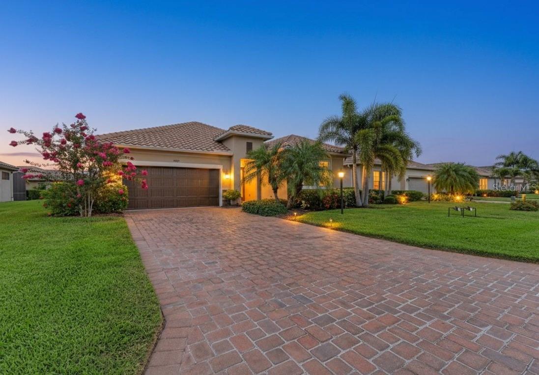 Virtually Staged. Meticulously maintained and beautifully updated, this move-in ready Ashton Woods Lazio model offers the perfect blend of style, comfort, and low-maintenance living in the highly sought-after gated community of Rosedale Golf & Country Club. Located in the maintenance-free section with NO CDD fees, lawn care, cable TV, and high-speed internet are all included.

Inside, you'll find 3 bedrooms, 2 bathrooms, and nearly 1,700 square feet of thoughtfully designed living space featuring an open floor plan, fresh coastal-inspired paint, updated lighting, luxury vinyl plank flooring in all bedrooms, and no carpet throughout. The beautifully appointed kitchen is the heart of the home with quartz countertops, a large island, 42-inch shaker cabinets, designer backsplash, stainless steel appliances, and a gas range—perfect for everyday living and entertaining.

The spacious primary suite has been freshly painted a crisp, neutral white and features a tray ceiling, walk-in closet, and refreshed ensuite bath. Step outside to the covered lanai overlooking peaceful landscaping with a peek of the water. Already pre-plumbed for an outdoor kitchen and pre-wired for a future pool and spa, this backyard is ready to become your own private Florida oasis.

Additional highlights include hurricane screens, an impact glass front window, tankless gas water heater, in-wall pest control system, irrigation system, and the washer and dryer are included.

Enjoy resort-style amenities including a staffed gated entrance, Junior Olympic pool, fitness center, tennis courts, clubhouse, restaurant and bar, dog parks, golf cart-friendly streets, and optional golf memberships. Just minutes from Lakewood Ranch's premier shopping, dining, entertainment, and the Gulf Coast's world-famous beaches, this home truly offers the Florida lifestyle you've been looking for.