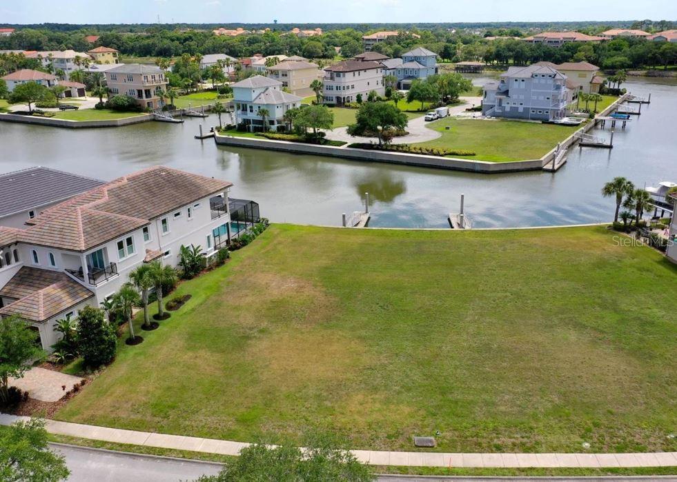 Turn key, build ready, cleared & level vacant lot in a private gated waterfront community in "The Hammock" of Palm Coast. Coveted deep saltwater frontage. Design & build your dream home on this premier deep saltwater lot in Yacht Harbor Village. Only 30 seconds to the ICW connecting to the Atlantic Ocean & 1 minute to the waterfront gas station. 20 minute boat ride north to Matanzas Inlet leading to the Atlantic Ocean. Very private lot, 21 acre forest across the street. A boaters paradise w/ a private concrete floating dock in your backyard. Flood Zone "X". Less than 1 mile to beach out the private gate at Jungle Hut Road. Land is cleared, flat and ready to build. The custom homes in this community are second-to-none. We have access to some custom floorplans to consider your new build. The sunset views are amazing from this lot with tons of wildlife including dolphins, manatees, abundant varieties of fish and birds. Owners have the option of joining the Hammock Beach Golf & Resort, only 1 mile away from lot, which also includes access to the Conservatory Golf Club & Yacht Harbor Village Club. 3 private clubs for one low price. 10 pools, private beach access, 2 championship golf courses (1 oceanfront), a world class spa, state-of-the-art fitness center, fantasy pool complex with a lazy river, waterslide, tennis courts, mini golf, 8 different restaurants and so much more. Call today for your private showing. Boundary survey & geotech reports on file.