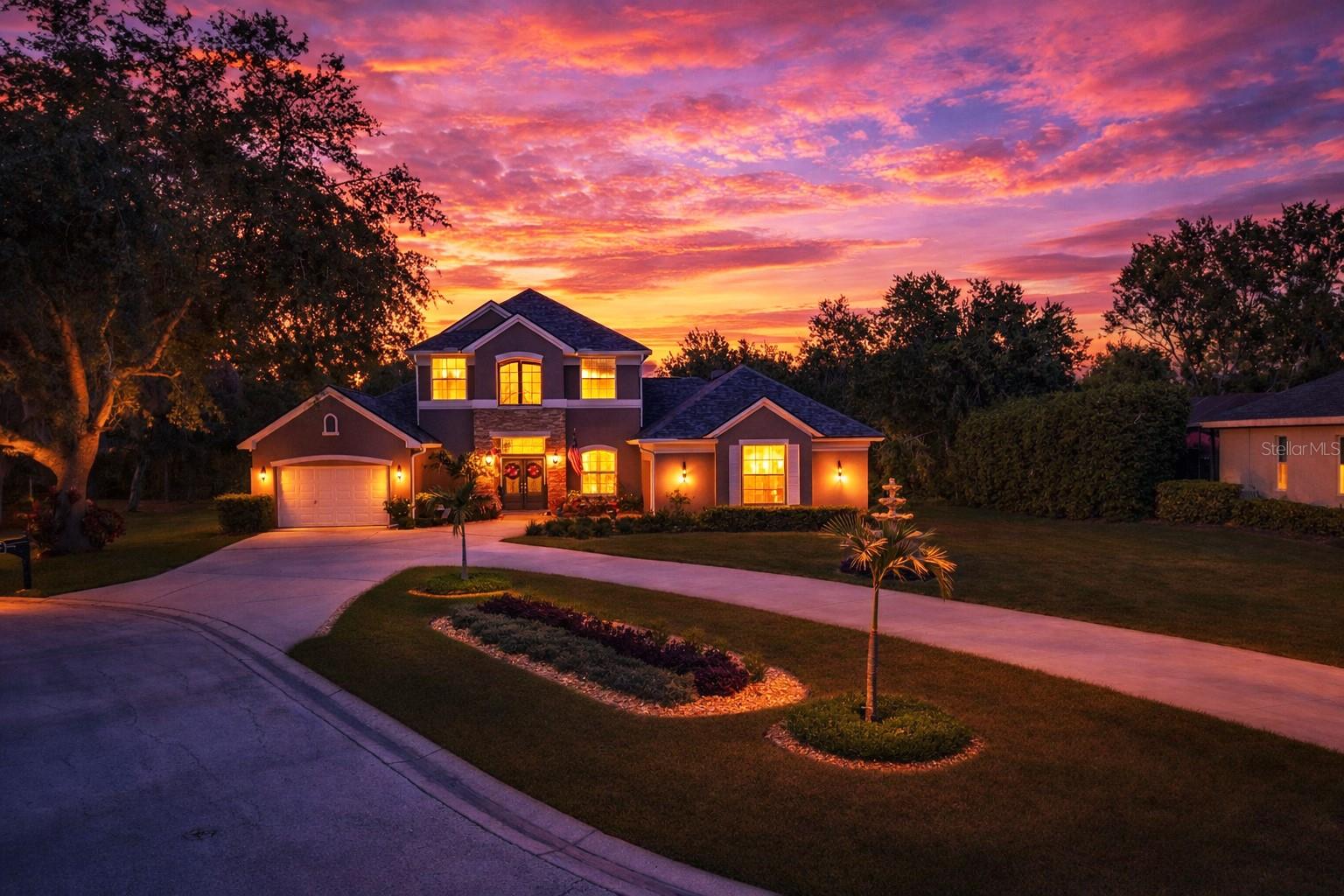 Stunning executive pool home with luxury upgrades throughout! Step into a world of refined elegance and sophistication at this masterfully re-imagined estate in the prestigious enclave of Walden Lake. Perfectly situated on nearly an acre at the end of a tranquil cul-de-sac, this 4-bedroom, 3.5-bath custom residence offers an expansive open-concept layout infused with upscale finishes and luxury details throughout. The grand, open floor plan invites effortless entertaining and comfortable living, featuring soaring ceilings, abundant natural light, and seamless transitions between formal and casual living spaces. Every inch of the interior has been thoughtfully transformed into an ensemble of bespoke opulence. Grand entryway doors, foyer lighting and décor appointments, custom staircase and loft railings,lavish window treatments including  electronic banded blinds, crown molding and elevated base boards floating on the bourbon marbled luxury vinyl throughout. At the heart of the home lies a gourmet kitchen fit for a culinary enthusiast, featuring a premium three oven array featuring both ZLINE and Janska units, a Janska Professional 48” eight-burner propane range with premium range hood, custom island with farmhouse single basin sink, ZLINE dishwasher and refrigerator, and 42” custom cabinetry. A 120-gallon propane tank ensures peak performance, while designer lighting sets a dramatic tone. Adjacent to the kitchen, a spacious family room and formal dining area create the ideal backdrop for both intimate gatherings and grand affairs replete with wood burning fireplace. The primary suite is a sanctuary unto itself, complete with custom plantation shutters, arched breezeway, tray ceiling  and a brand-new spa-inspired en-suite bathroom adorned with premium vanity, free-standing soaking tub and an open shower design. Three additional bedrooms and guest baths offer comfort and style that mirror the home’s refined aesthetic. Step outdoors and discover your private cabana-style oasis. The expansive screen-enclosed pool lanai is a true showstopper—surrounded by lush new landscaping, mature palm trees, new aluminum surround fencing, and a tranquil ambiance perfect for both relaxation and entertaining. Lounge in the shade, dine al fresco, or host unforgettable gatherings in this resort-inspired setting including a custom stained teak tiki bar with outdoor kitchen. The front yard makes a striking impression with a three-tier fountain, manicured grounds, and a newly painted exterior in 2025. Additional enhancements include: WiFi-enabled irrigation system, new outdoor lighting with timer switches, Samsung front-load washer and dryer, garage storage cabinetry, all new hinges and door hardware throughout, new WiFi enabled water heater 2024, and new roof 2022. This exceptional residence blends timeless architecture with contemporary luxury, all set within a well-established and secure community. Rest assured knowing no one can build to the rear of the property as it borders conservation land. 3008 Sutton Woods Dr is more than a home—it’s a statement of lifestyle. Walden Lake features winding golf cart trails, a dog park, and boat ramp onto the lake for non-motorized watercraft. Close to downtown Plant City, minutes from shopping, convenient to West Coast beaches and Orlando theme parks. Schedule your private showing today and experience the pinnacle of Florida living.