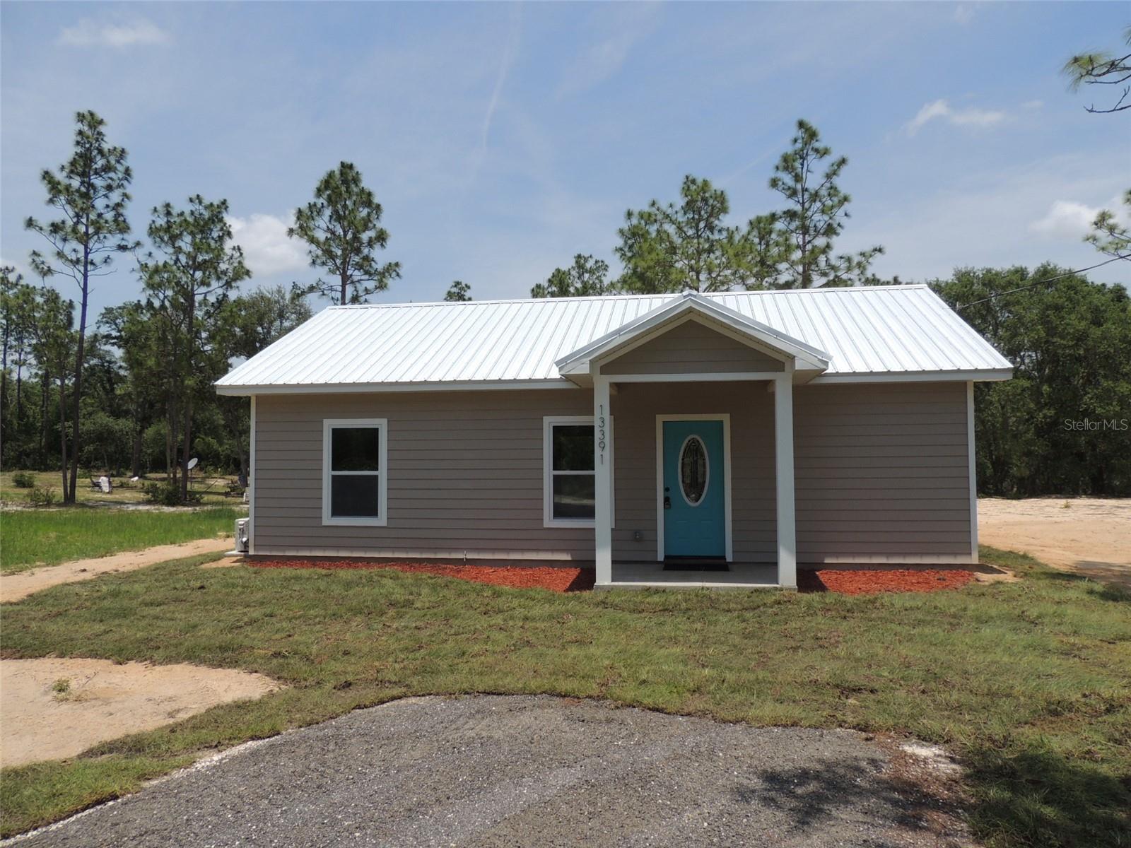 BRAND NEW AND ALMOST MOVE-IN READY! Centrally located off Highway 27Alt between Williston and Bronson you will find this, almost completed, 1 bedroom, 1 bath home. Nicely situated on a .20 acre lot this home has plenty of great features. Kitchen includes Granite countertops, all wood cabinets, flat-top range, microwave range hood, stainless dishwasher and refrigerator. Bathroom has a custom tiled stall shower and the bedroom has a full length wardrobe closet. Luxury vinyl plank flooring throughout. Two mini-split Heat & A/C units allow separate control of the living area and bedroom. Double pane, insulated windows and a metal roof make the home energy efficient. Full length covered back porch with rustic Pine siding and 2 ceiling fans and laundry/utility room. A portion of the back porch ceiling has been insulated for an additional bedroom.