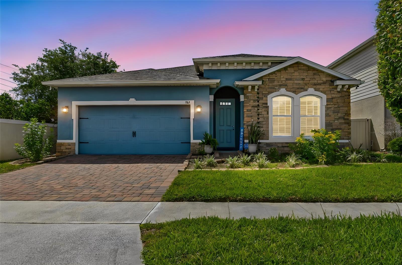 Welcome to this stunning open-concept home, where modern style meets everyday comfort. Built in 2020, this beautifully maintained single-story residence offers 4 bedrooms, 2 bathrooms, and thoughtfully designed living spaces perfect for entertaining and family living.
The heart of the home is the spacious kitchen, featuring rich dark cabinetry, granite countertops, stainless steel appliances, and an open layout that flows seamlessly into the living and dining areas. Custom accent paneling, updated light fixtures, and fresh interior paint add a contemporary touch, while durable tile flooring extends throughout the entire home, including all bedrooms. Both bathrooms continue the elegant design with matching granite countertops and dark cabinetry.
The backyard offers peaceful wooded views that provide beautiful sunset scenery each evening, while mature landscaping enhances the home's curb appeal and creates an inviting outdoor setting.
Residents enjoy access to the community's private clubhouse and resort-style pool, while the prime location places you just minutes from ChampionsGate's shopping and dining, Walt Disney World, and major highways, making commuting and entertainment effortless.
All stainless steel kitchen appliances convey, making this home truly move-in ready. Combining modern finishes, a serene setting, and an unbeatable location, this exceptional home is one you won't want to miss. Schedule your private showing today!