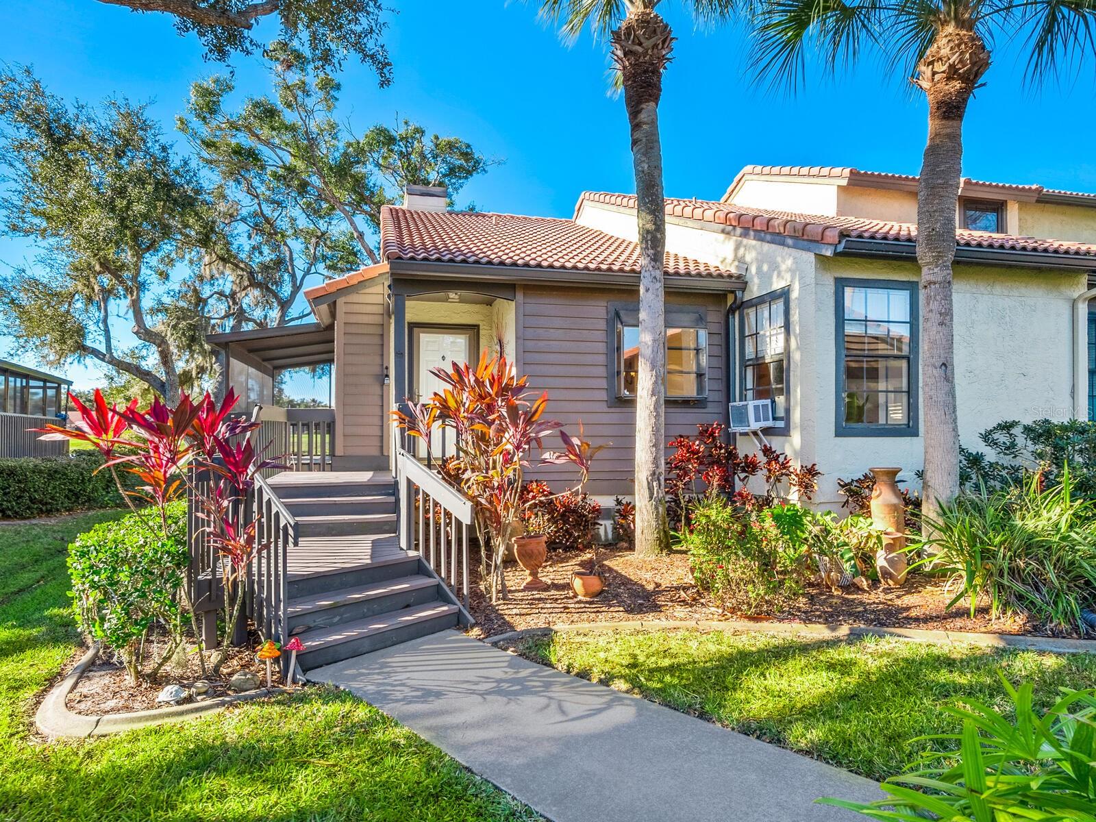 The sought-after Lakes Estates of Sarasota is a hidden gem offering a wonderful blend of space, privacy, and serene natural beauty. This LAKEFRONT , maintenance-free villa features 2 bedrooms, 2 bathrooms, and over 1,200 square feet of living space. Remodeled in 2020 this split floor plan is enhanced by vaulted ceilings that create an open, airy feel. The eat-in kitchen is thoughtfully designed for both everyday living and entertaining, featuring a charming plant window, breakfast bar, and seamless connection to the dining and living areas. Just off the living room, a generously sized screened-in porch provides the perfect setting for indoor-outdoor living and entertaining, with peaceful lake views just beyond. The primary suite serves as a private retreat, complete with a walk-in closet and an en-suite bath with a stand-up shower. French doors open directly to a covered screened deck, placing you just steps from the water and offering a remarkable start or end to each day. NEW HVAC 8/2025 and adding to the property’s comfort and convenience is a one-car garage plus a carport. Residents enjoy winding, tree-lined, lighted streets and a scenic waterfront walking path that leads to the community’s resort-style amenities, including two pools, tennis and pickleball courts, fitness center, clubhouse, playground, and a picturesque central lake with fountain for added ambiance. Just a few blocks away, the pristine Legacy Trail offers 18 miles of paved paths stretching from Sarasota to Venice, perfect for biking, walking, and outdoor exercise, with relief pavilions and eateries along the way. The location is exceptional—minutes from area beaches, shopping, dining, and entertainment. Located in a popular school district, Lakes of Sarasota is not an age-restricted community, making this villa ideal for a wide range of lifestyles for those seeking a balance between suburban tranquility and easy access to urban amenities.