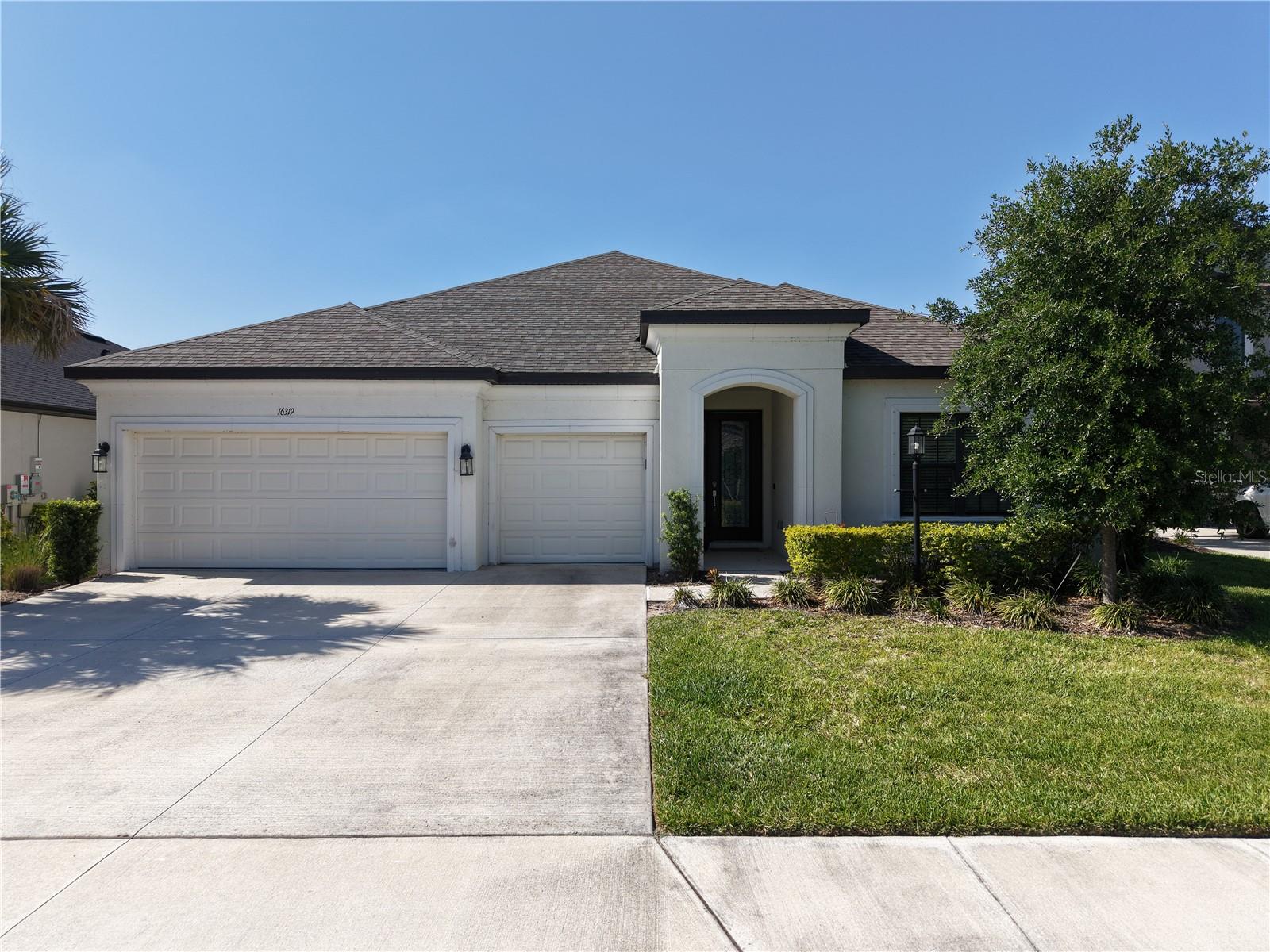 Welcome to this stunning Java model in Park East at Azario in Lakewood Ranch, offering 2,702 sq ft of thoughtfully designed living space with 4 bedrooms, 3.5 bathrooms, a spacious den, and a 3-car garage. Perfectly positioned on a beautiful waterfront homesite, this single-story residence blends luxury, functionality, and modern Florida living.

Step inside through the grand foyer featuring soaring ceilings and an elegant double tray ceiling that creates an impressive first impression. Designer finishes are showcased throughout, including luxury vinyl plank flooring, upgraded details, and an open-concept layout ideal for everyday living and entertaining.

The chef’s kitchen is a standout, complete with premium Monogram appliances, abundant cabinetry, and seamless flow into the dining and great room areas. The dining space offers breathtaking panoramic water views, while pocketing sliding glass doors open to the expansive covered lanai already pre-plumbed for an outdoor kitchen creating the ultimate indoor-outdoor lifestyle.

The oversized great room features a tray ceiling and generous entertaining space, while the versatile den with tray ceiling can function as a home office, playroom, media room, or optional 5th bedroom.

The private primary suite is a luxurious retreat with double-door entry to the spa-inspired en suite bath featuring a large walk-in shower with rain shower feature, dual vanities, and spacious layout. Two secondary bedrooms include private en suite baths with upgraded tile and cabinetry, offering comfort and privacy for guests or family.

Situated on an impressive 150-foot deep lot, this property offers exceptional outdoor space with plenty of room to add a custom pool while still enjoying expansive yard space and tranquil water views.

Located in sought-after Park East at Azario, residents enjoy outstanding neighborhood amenities including a community pool, volleyball courts, basketball courts, dog parks, sports fields, playgrounds, and lots of community events throughout the year. This home is also within walking distance to the new Lake Manatee K-8 School.

This exceptional waterfront home offers the perfect combination of elegance, comfort, lifestyle, and location an incredible opportunity in one of Lakewood Ranch’s fastest-growing communities.