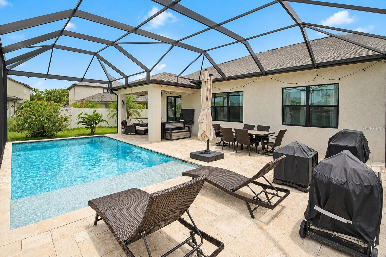 STUNNING LAKEFRONT POOL HOME IN CEDAR GROVE – 5 BEDROOMS | 3 BATHS | FLOOD ZONE X

Discover Florida living at its finest in this move-in ready lakefront pool home located on a quiet cul-de-sac in the highly desirable Cedar Grove community of North Port. Built in 2016 and offering approximately 3,542 total square feet, this spacious residence combines comfort, functionality, and exceptional outdoor living.

Located in Flood Zone X, where flood insurance is currently not required by most lenders, this property offers added peace of mind and potential savings.

Step inside to an inviting open-concept floor plan featuring soaring ceilings, abundant natural light, decorative architectural details, fresh interior and exterior paint, Ethernet wiring throughout, and multiple living spaces perfect for both everyday living and entertaining.

The chef-inspired kitchen is the heart of the home and showcases granite countertops, stainless steel appliances, a large center island, spacious walk-in pantry, new refrigerator, and induction convection self-cleaning range. The kitchen seamlessly flows into the great room and opens to the screened lanai overlooking the lake and heated pool.

The flexible floor plan offers 2 bedrooms on the first floor and 3 bedrooms upstairs, ideal for multi-generational living, guests, or a home office setup. The first-floor owner's suite features a spacious walk-in closet, dressing area, and private ensuite bath. Upstairs, a large loft provides endless possibilities as a media room, game room, home office, fitness area, or playroom.

Step outside and enjoy your own private tropical retreat featuring:

• Custom heated swimming pool
• Aluminum screened pool enclosure
• Beautiful lake views
• Mature palm trees
• Bougainvilleas
• Banana trees
• Producing mango tree

Additional upgrades include:

• Epoxy-coated garage floor
• New garage door opener with battery backup
• Generator pre-wire system
• Portable generator and connection cable included
• Steel overhead garage storage racks
• Rare additional parking space

Residents of Cedar Grove enjoy access to community amenities including a heated community pool, fenced playground, restrooms, and direct mail delivery service. HOA fees remain attractive because homeowners maintain their own lawns.

Conveniently located near I-75, shopping, dining, golf courses, medical facilities, Wellen Park, downtown Venice, and world-famous Gulf Coast beaches including Siesta Key Beach.

Whether you're looking for a primary residence, seasonal Florida retreat, or spacious family home, this exceptional lakefront pool property offers the lifestyle you've been searching for.

Easy to show. Quick closing available. Schedule your showing today!