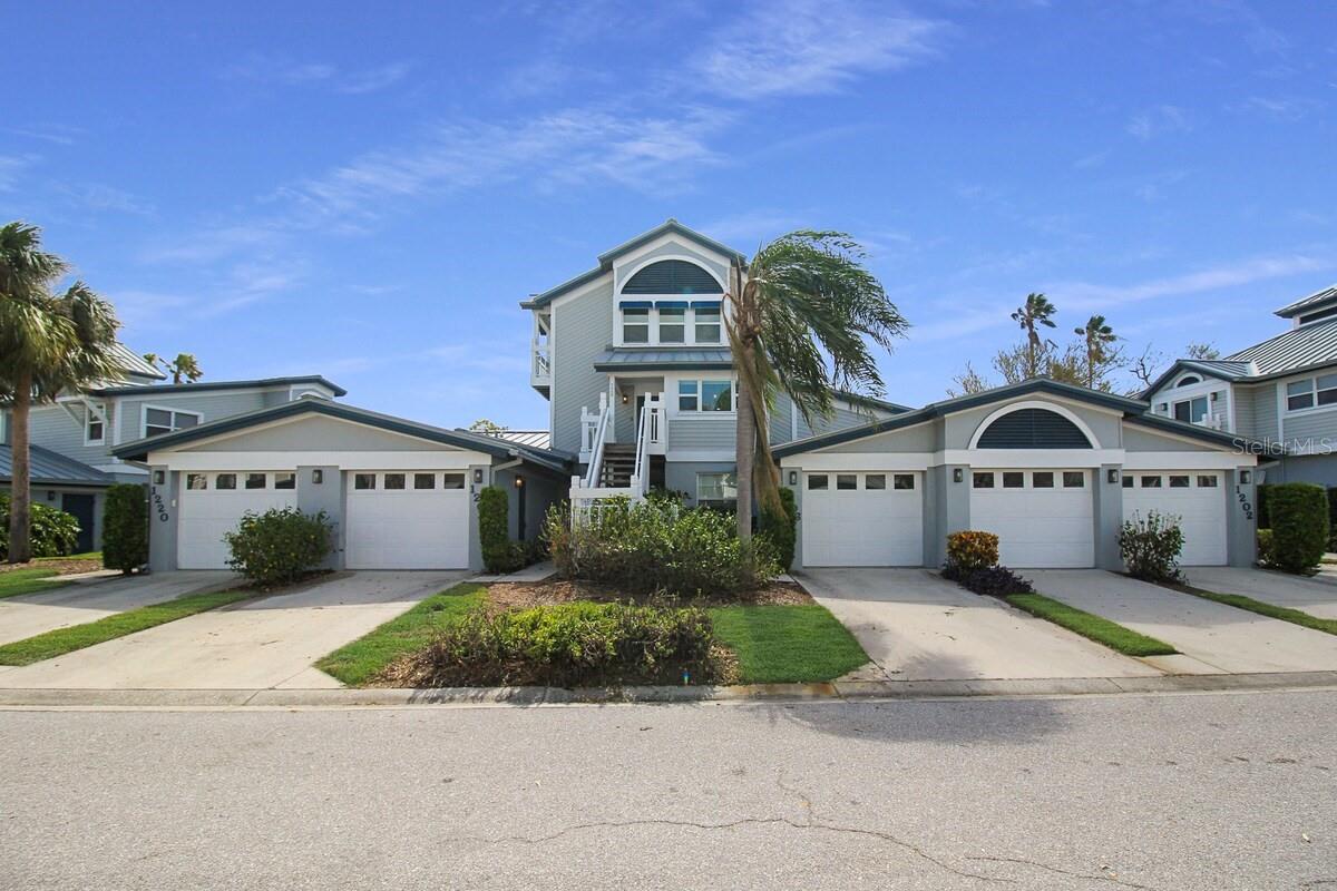 Experience coastal living and investment potential in this beautifully appointed 3-bedroom, 2-bathroom townhome, ideally located in the highly sought-after Gulf and Bay Club Bayside community on Siesta Key. Just minutes from the world-renowned beaches and Siesta Key Village, this property offers the perfect blend of relaxation and convenience to shopping, dining and entertainment.

This turn-key furnished 3-bedroom, 2-bathroom townhome is thoughtfully designed for both comfort and functionality, featuring a desirable first-floor primary suite complete with a spacious walk-in closet and a beautifully updated en-suite bathroom showcasing a stunning marble walk-in shower. The third floor offers two spacious bedrooms along with a full bathroom featuring dual vanity sinks and a walk-in shower, providing a private and comfortable retreat for guests or family.

The residence offers a light-filled, open layout enhanced by luxury vinyl plank flooring throughout, creating a modern and cohesive feel. The well-equipped kitchen is outfitted with stainless steel appliances and includes a charming breakfast nook—perfect for casual dining—while the living and dining room combination flows seamlessly to a beautiful screened-in lanai overlooking the pool, tennis courts, and lake—ideal for relaxing or entertaining in a serene setting.

Gulf and Bay Club Bayside residents enjoy resort-style amenities, including a pool, clubhouse, fitness center, tennis courts, and private deeded beach access just minutes away. With weekly rentals allowed, this property presents an outstanding opportunity for investors seeking strong income potential or buyers looking for a flexible vacation home.