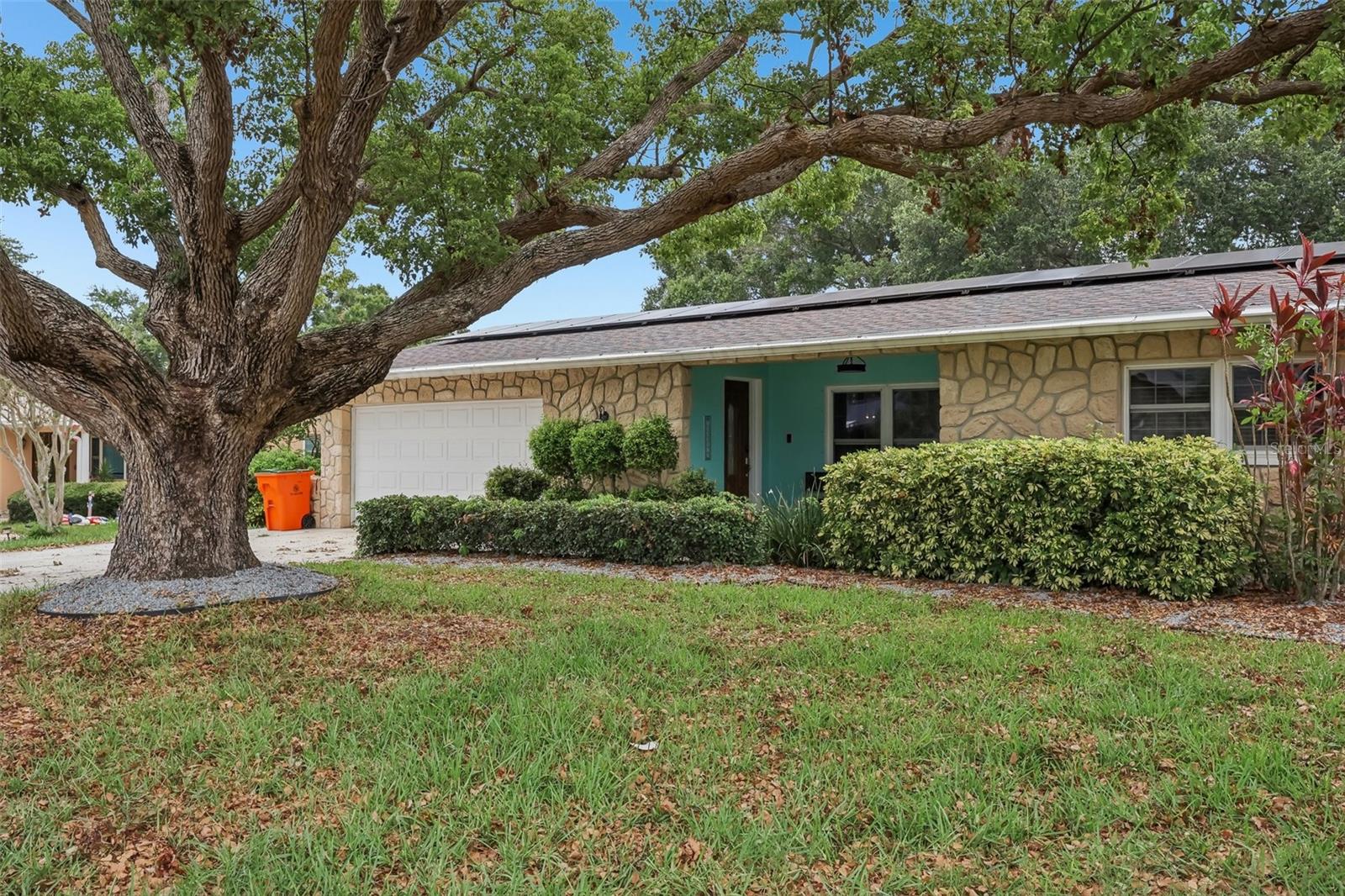 Welcome to this sophisticated Florida Dream Home that comes fully furnished and completely turnkey. Showcasing a highly desirable split bedroom floor plan and a seamless kitchen-and-family-room combination. This open-concept layout creates an inviting atmosphere that is perfectly tailored for both upscale entertaining and modern everyday living. The gourmet kitchen stands as the heart of the home, fully equipped with premium stone countertops, high-end Whirlpool appliances, and a built-in reverse osmosis water filtration system. Head outside into your own private sanctuary, where professionally curated, lush tropical landscaping frames a fully fenced backyard, a sparkling swimming pool, and an integrated, relaxing waterfall spa. The property has been meticulously maintained with significant capital improvements, including a newer roof (2021) and high-efficiency solar panels (2023) designed to optimize energy savings. Additional premium details include a pristine epoxy-finished garage floor and an abundance of dedicated storage space with oversized closets throughout, full pool heater, luxurious hot tub spa, outdoor bar/playhouse, vaulted screened in lanai, interior and exterior paint, landscaping, and tastefully decorating each room for the entertainers dream! Perfectly positioned in unincorporated Pinellas County, this property offers distinct tax advantages and is situated within the highly acclaimed, top-rated Seminole School District as well as being short term renter friendly. Furthermore, the home is located in Flood Zone X, ensuring peace of mind with no lender-required flood insurance. Located just minutes from the pristine, white-sand Gulf Beaches, this exceptional property perfectly blends structural integrity, modern luxury, and an unbeatable coastal lifestyle. Book your private tour today! Mortgage savings may be available for buyers of this listing.