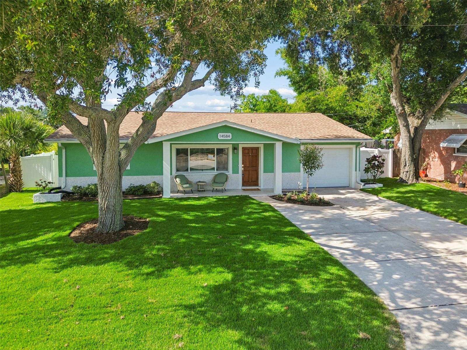 Welcome home to this beautifully renovated 3-bedroom, 2-bath residence featuring a spacious office that can easily serve as a fourth bedroom for guest. With an expansive open-concept layout, two separate living areas, and abundant natural light, this home lives much larger than its square footage.
Located just one mile from the beautiful Gulf beaches, you'll enjoy the convenience of walking, biking, or jogging to the waterfront for breathtaking sunsets, beach days, and the Florida lifestyle you've been dreaming of. Even better, short-term rentals are allowed, making this an exceptional opportunity as a primary residence, vacation home, or income-producing investment.
From the moment you arrive, you'll appreciate the fresh landscaping and the newly finished tabby shell front porch, creating the perfect place to relax with your morning coffee or unwind in the evening. The home is topped with a brand-new GAF roof backed by a 30-year warranty for added peace of mind.
Step inside to discover a completely reimagined interior with high-end finishes throughout. New luxury flooring flows seamlessly into the stunning kitchen, featuring custom cabinetry, quartz countertops, stainless steel appliances, and a spacious layout designed for both everyday living and entertaining.
On one side of the home, you'll find two generously sized guest bedrooms and a beautifully remodeled bathroom. The main living area opens effortlessly to a second family room with oversized sliding glass doors leading to a 348-square-foot screened lanai showcasing custom tile work, creating an incredible indoor-outdoor living experience.
Adjacent to the family room is the versatile office or bonus room, while the opposite side of the home is dedicated to the private primary suite. Large windows fill the space with natural light, and the spa-inspired en suite bathroom provides the perfect retreat at the end of the day.
A convenient mudroom connects the oversized two-car garage to the living area, creating the perfect drop zone for shoes, backpacks, beach gear, and everyday essentials. The garage also offers additional storage space, making organization easy.
The fenced backyard offers privacy today, with newly planted trees that will continue to mature and enhance the setting for years to come. Additional highlights include a brand-new 2026 air conditioning system and thoughtful upgrades throughout.
This move-in-ready home combines quality craftsmanship, modern style, an unbeatable location, and exceptional functionality. Schedule your private showing today.