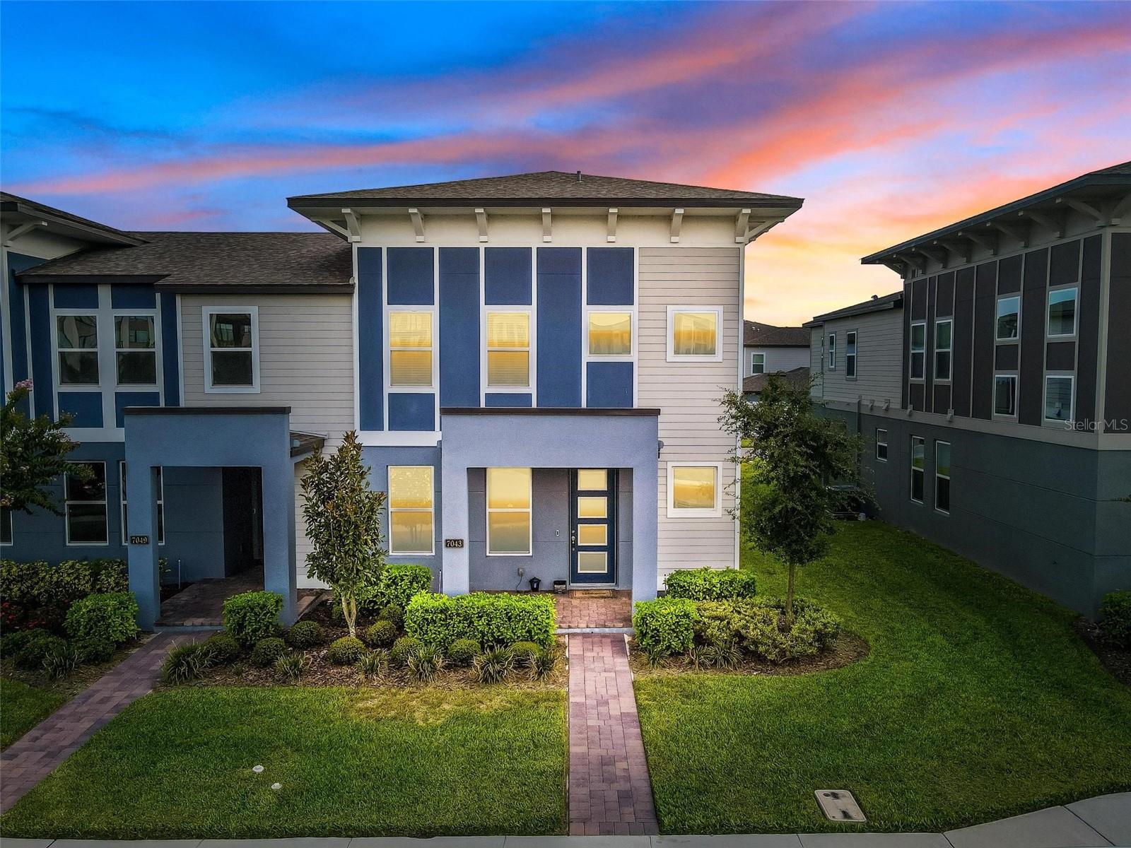 Welcome to luxury living in the highly sought-after gated community of Sand Lake Sound in the heart of Dr. Phillips. Built in 2020 by Meritage Homes, this extensively upgraded Calabasas model offers 1,945 square feet of thoughtfully designed living space with 3 bedrooms, 2.5 bathrooms, a rear-entry spacious 2-car garage, resort-style outdoor living, and more than $50,000 in premium builder upgrades. Positioned on a premium oversized lot for enhanced privacy and outdoor space, this home combines contemporary design, energy-efficient windows and construction, and low-maintenance luxury living just minutes from Orlando’s renowned Restaurant Row, world-class attractions, and major highways. The open-concept first floor features a bright and inviting living area, spacious dining 
space, a flex room with walk-in closet, and a gourmet chef’s kitchen with quartz countertops serves as the centerpiece of the home and was extensively upgraded through the Meritage Design Center. Features include modern 42" cabinetry, stainless steel KitchenAid appliances (an electric stove, a microwave, double ovens), LG InstaView French Door Fridge, oversized quartz countertops, a big pantry, abundant 
storage, and luxury vinyl plank flooring throughout the main living areas. Modern 5.25-inch baseboards, upgraded 8-foot interior doors, Drift of Mist designer paint, and a dramatic custom staircase with silver aluminum railings and stainless-steel cables. Large sliding glass doors bring in natural light and provide access to the private outdoor patio area, ideal for relaxing or entertaining. Upstairs, the expansive primary suite offers a walk-in closet and a luxurious en-suite bathroom with dual vanities, a frameless glass shower enclosure, and designer tile finishes. Two additional bedrooms, a full bathroom with a frameless glass shower enclosure, and an upstairs laundry room completes the second level. This luxury townhouse is part of the gated community of Sand Lake Sound in the heart of Dr. Phillips and nestled among the three major theme parks, Disney World, Universal Orlando and Sea World and several other attractions like Volcano Bay and International 
Drive with bountiful shopping options. Schools in the area include Bay Meadows Elementary, Southwest Middle, and Dr. Phillips High. This townhouse is a perfect living option for work or entertainment as it features a wired-cable internet in every room, so it is ideal for a home office, a Ring security system with 24x7 monitoring so you can feel fully secured, 3-stage osmosis water filter, and an April Aire air conditioning system for a healthy air living. The community has direct access to Little and Big Sand Lakes and features a host of amenities including a dock with some of the most amazing lake views, a resort-style pool, clubhouse, kid's playground, and a splash pad. A short drive or walk from this community is the famed "Restaurant Row". Your family will want to call this home for many years, hurry- this opportunity won't last!